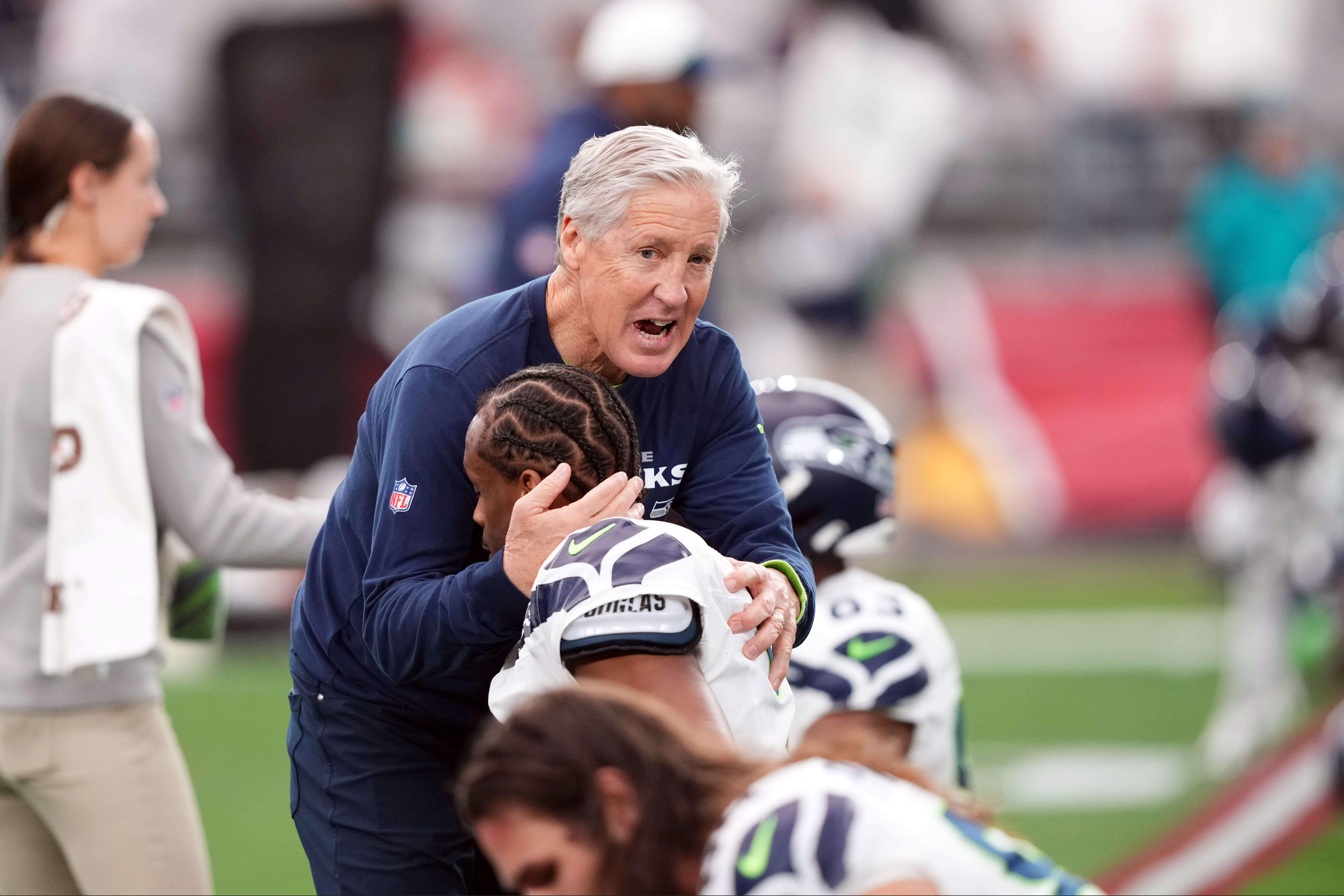 Jan 7, 2024; Glendale, Arizona, USA; Seattle Seahawks head coach Pete Carroll talks with players prior to facing the Arizona Cardinals at State Farm Stadium.