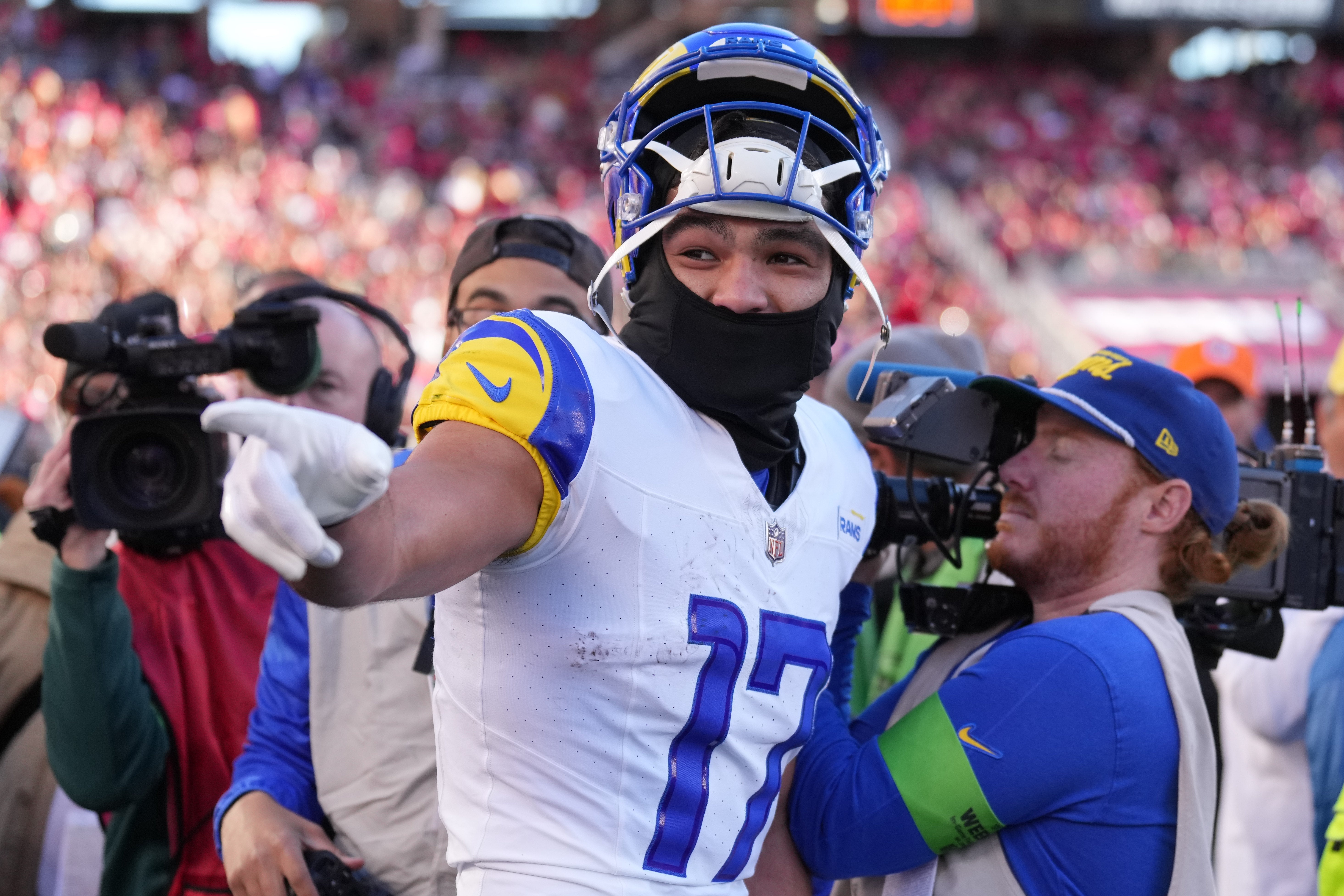 Jan 7, 2024; Santa Clara, California, USA; Los Angeles Rams wide receiver Puka Nacua (17) gestures on the sideline after setting the NFL record for receiving yards in a season by a rookie during the third quarter against the San Francisco 49ers at Levi's Stadium. Mandatory Credit: Darren Yamashita-USA TODAY Sports