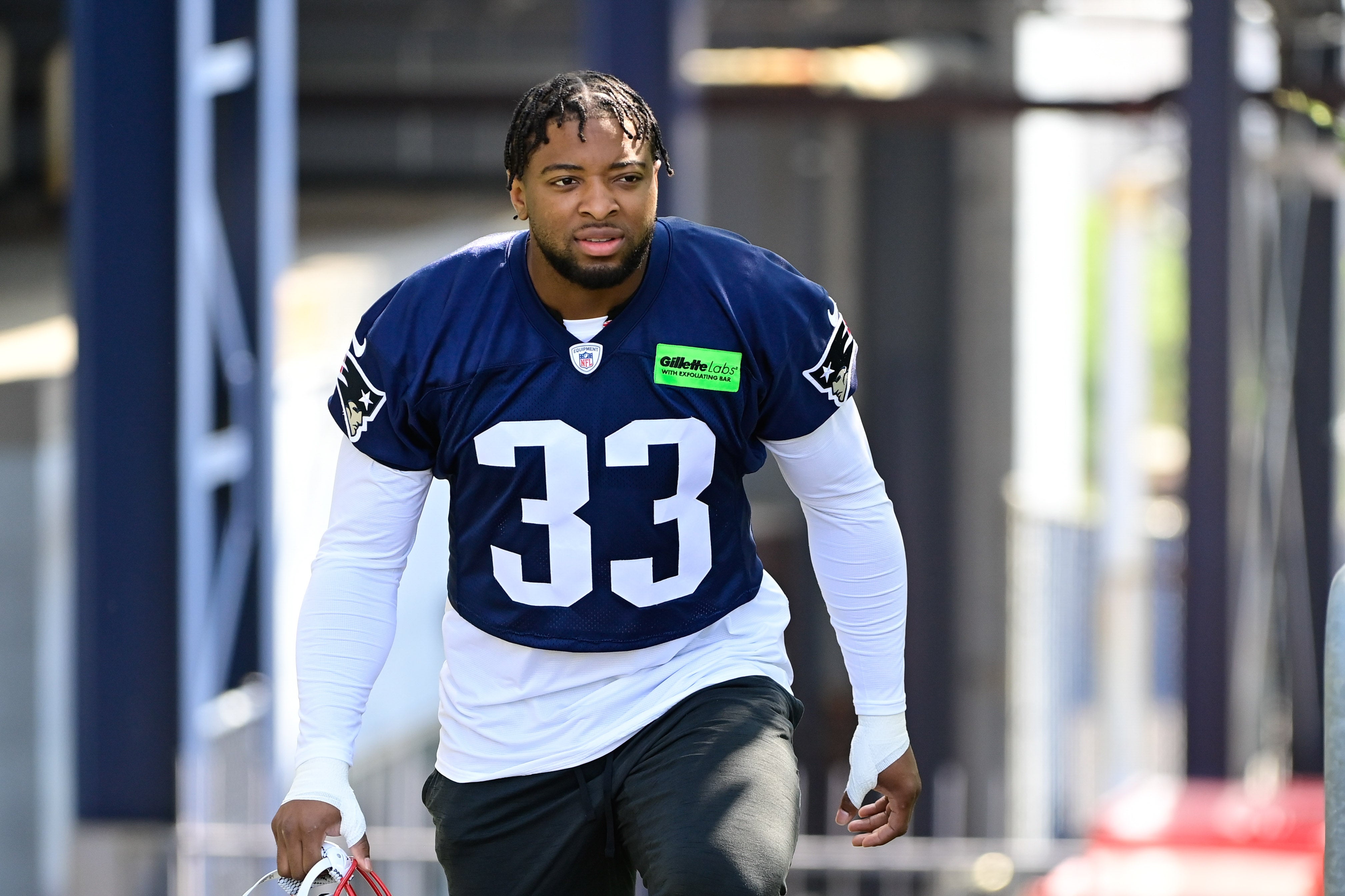 New England Patriots linebacker Anfernee Jennings makes his way to the practice fields for training camp at Gillette Stadium