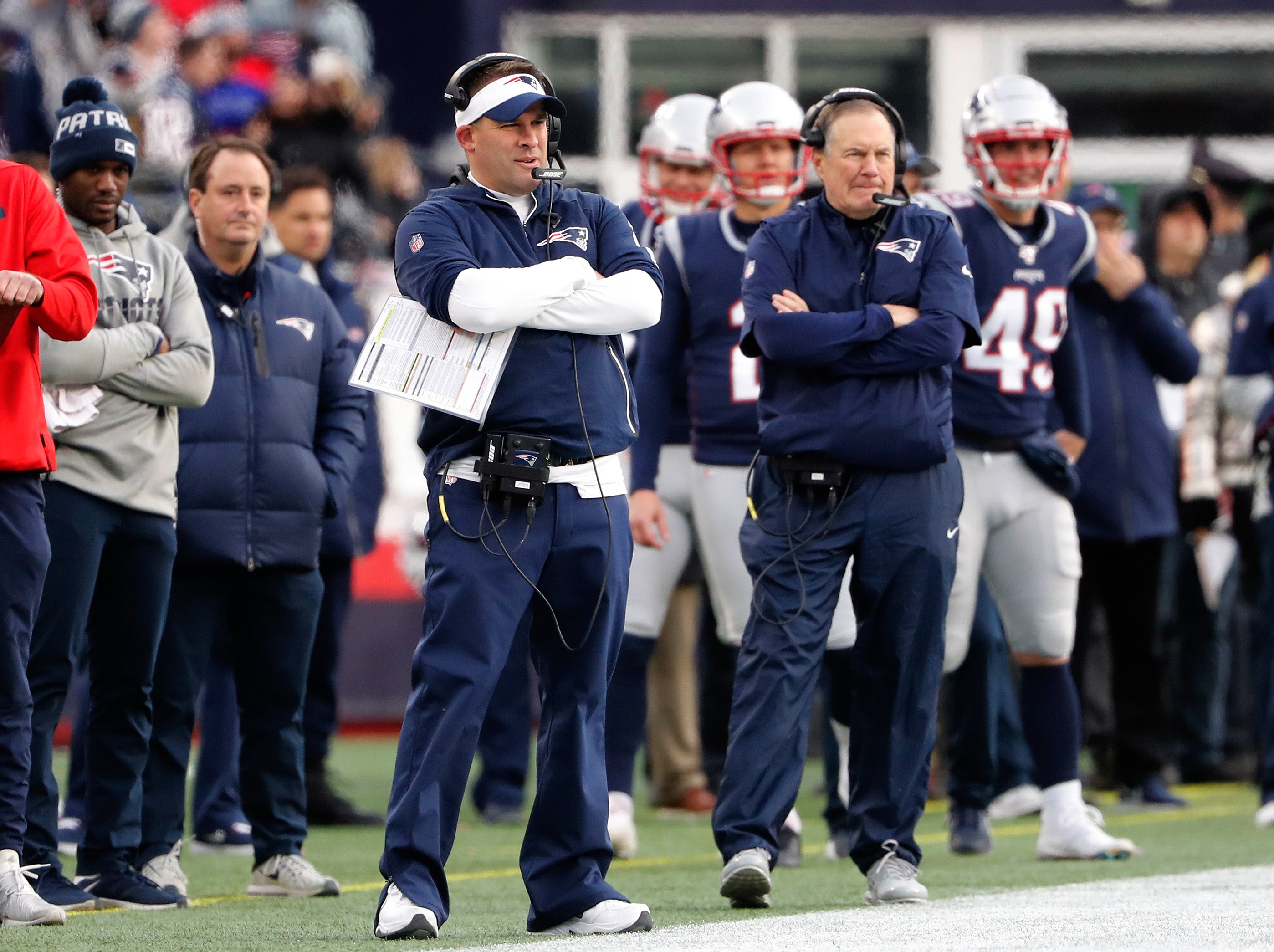 New England Patriots offensive coordinator Josh McDaniels looks on with head coach Bill Belichick during the second half against the Miami Dolphins at Gillette Stadium