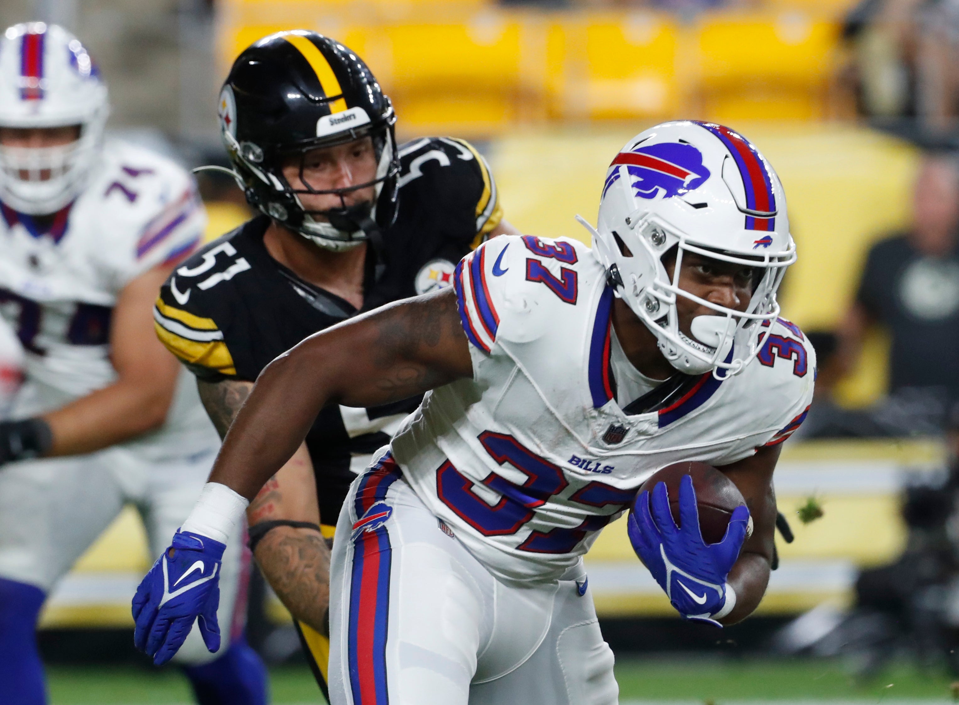 Aug 19, 2023; Pittsburgh, Pennsylvania, USA; Buffalo Bills running back Darrynton Evans (37) runs the ball against Pittsburgh Steelers linebacker Nick Herbig (51) during the third quarter at Acrisure Stadium. Pittsburgh won 27-15. Mandatory Credit: Charles LeClaire-USA TODAY Sports  