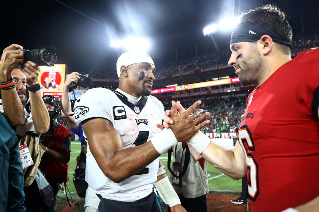 Philadelphia Eagles quarterback Jalen Hurts (1) and Tampa Bay Buccaneers quarterback Baker Mayfield (6) greet after the game at Raymond James Stadium.