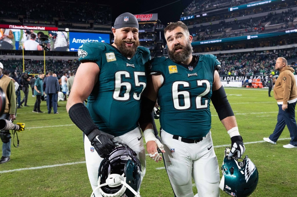 Philadelphia Eagles center Jason Kelce (62) and offensive tackle Lane Johnson (65) walk off the field together after a victory against the Dallas Cowboys at Lincoln Financial Field.