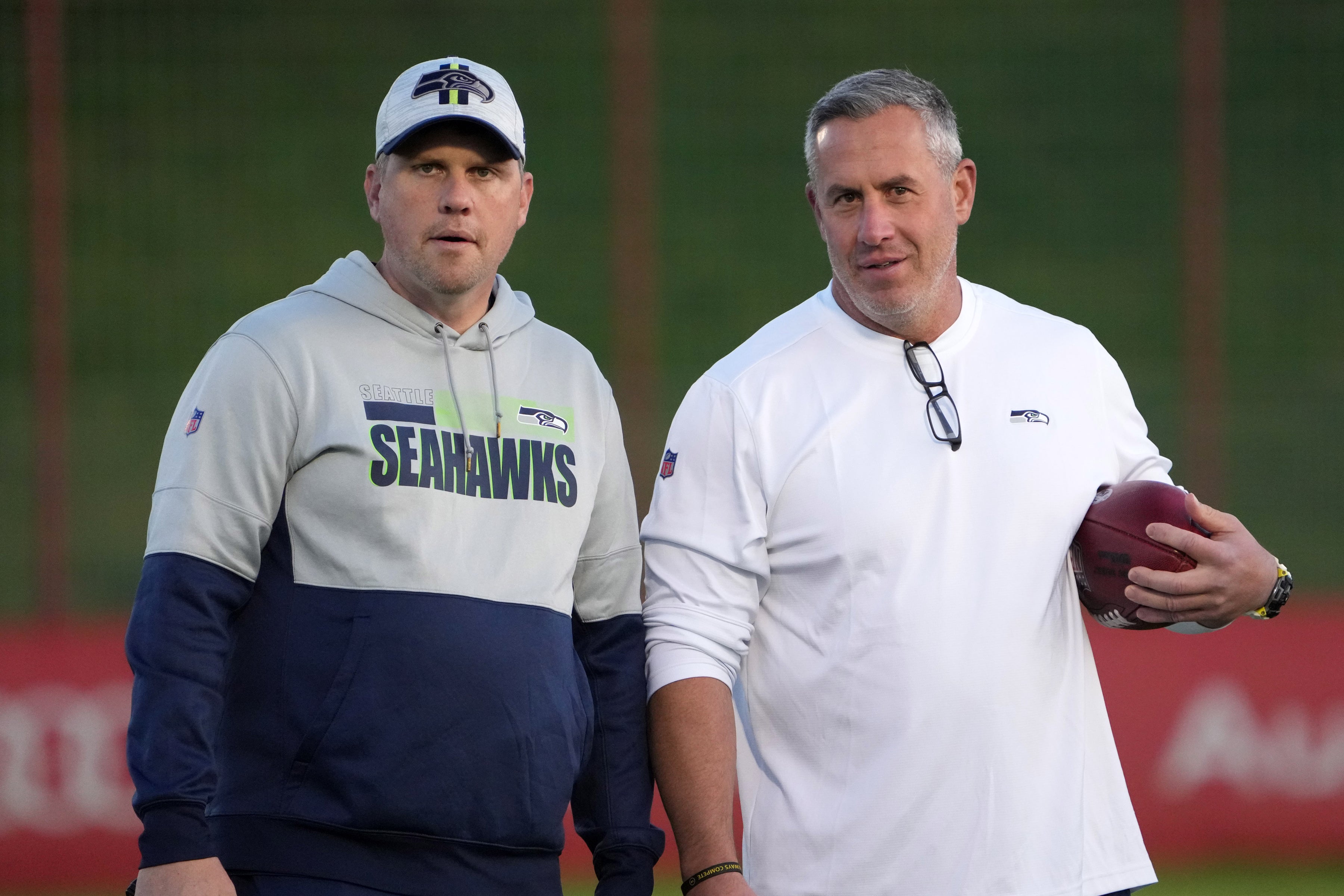 Nov 10, 2022; Munich, Germany; Seattle Seahawks offensive coordinator Shane Waldron (left) and tight ends coach Pat McPherson react during practice at FC Bayern Munich at Sabener Strabe.