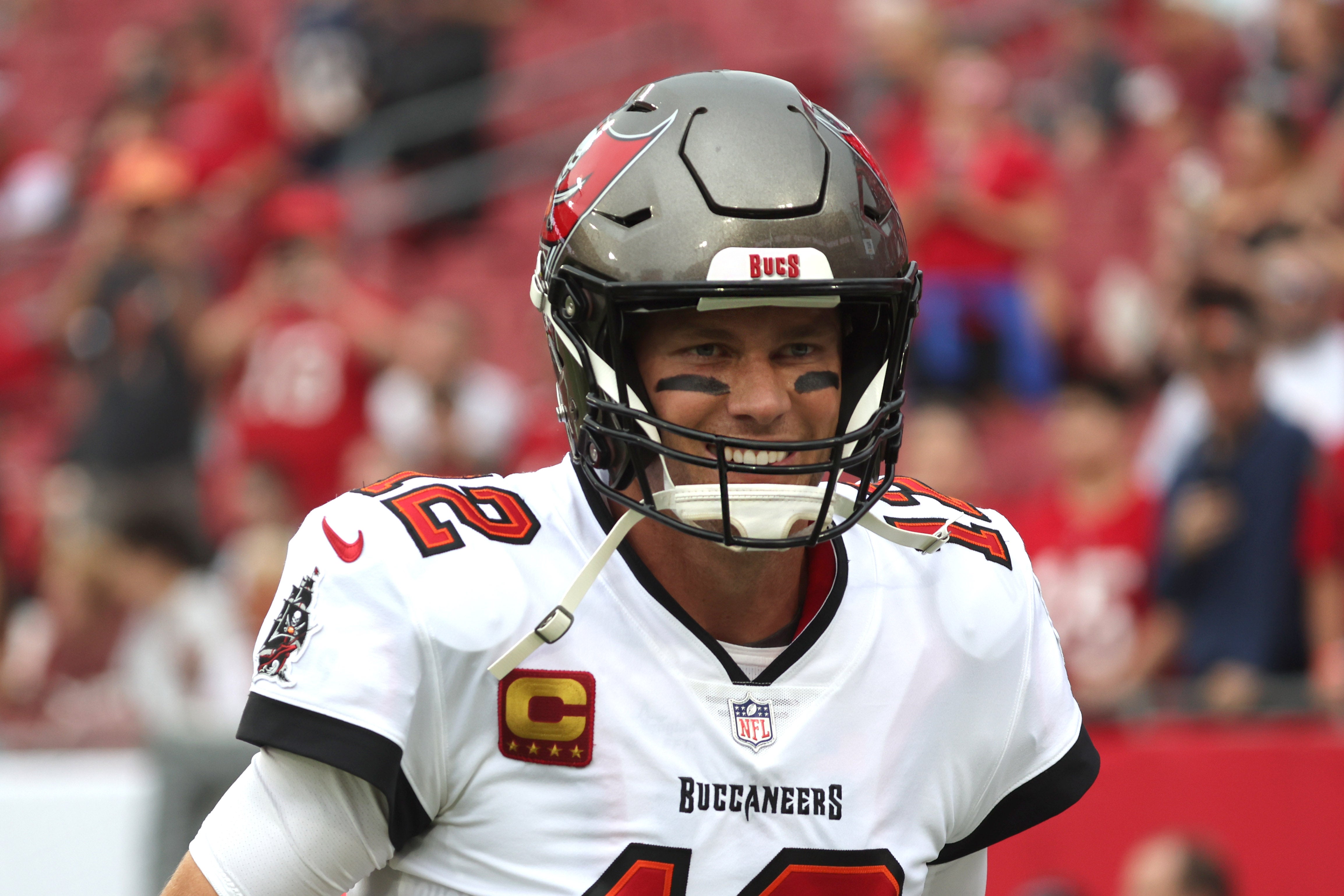 Jan 1, 2023; Tampa, Florida, USA; Tampa Bay Buccaneers quarterback Tom Brady (12) warms up against the Carolina Panthers prior to the game at Raymond James Stadium. Mandatory Credit: Kim Klement-USA TODAY Sports