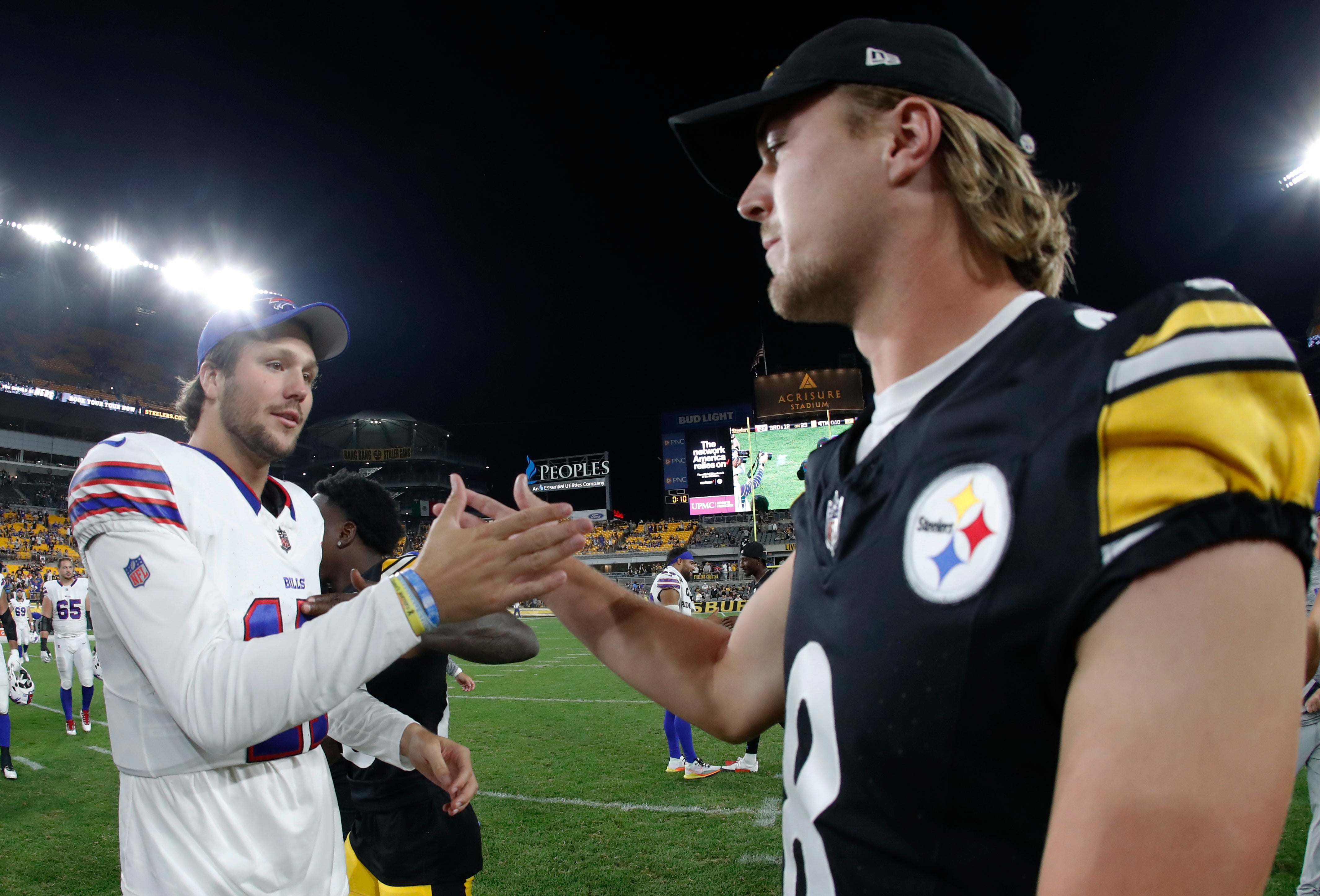 Aug 19, 2023; Pittsburgh, Pennsylvania, USA; Buffalo Bills quarterback Josh Allen (17) and Pittsburgh Steelers quarterback Kenny Pickett (8) shake hands after their game at Acrisure Stadium. Pittsburgh won 27-15. Mandatory Credit: Charles LeClaire-USA TODAY Sports