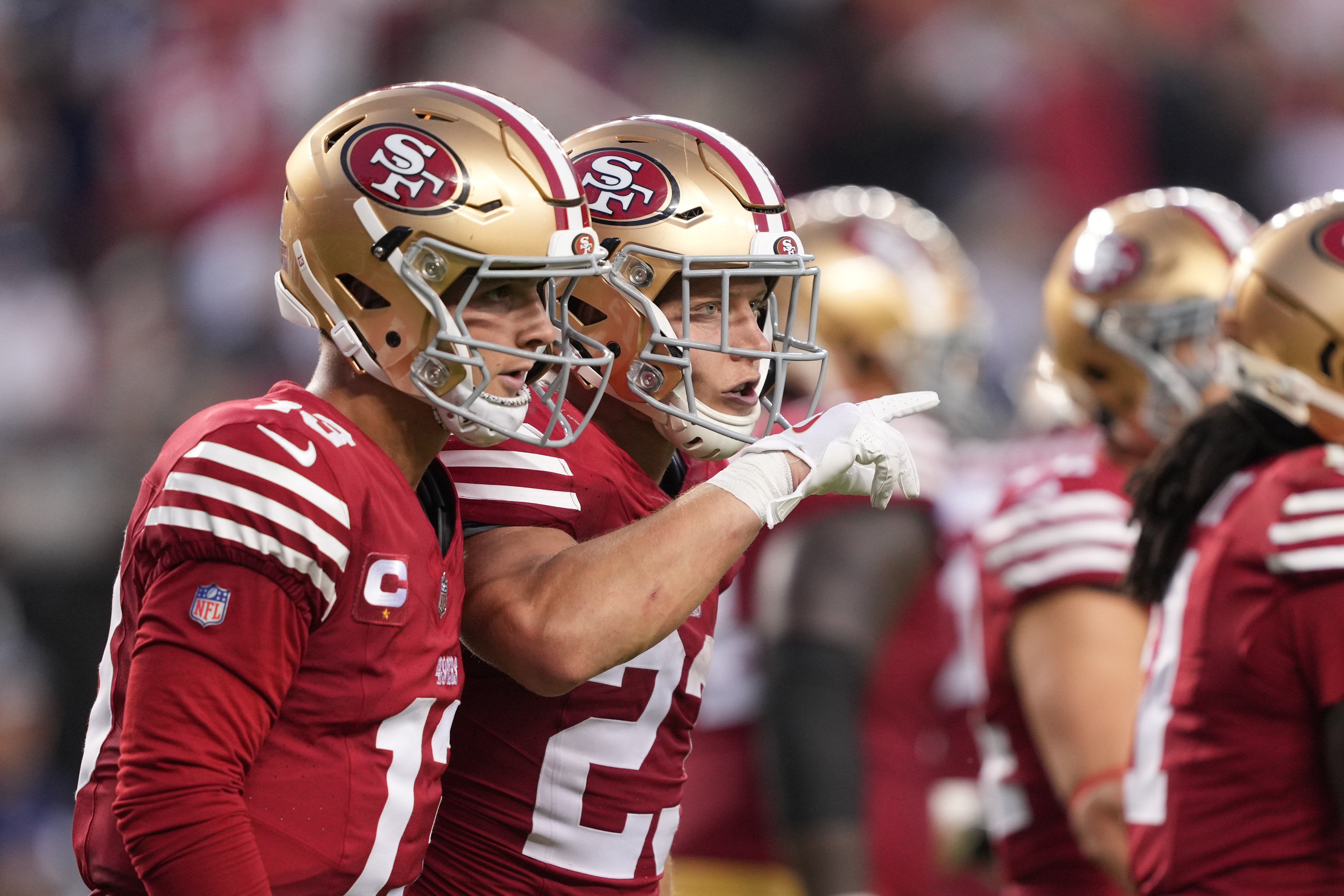 Oct 8, 2023; Santa Clara, California, USA; San Francisco 49ers running back Christian McCaffrey (right) celebrates with quarterback Brock Purdy (left) after scoring a touchdown against the Dallas Cowboys during the second quarter at Levi's Stadium.