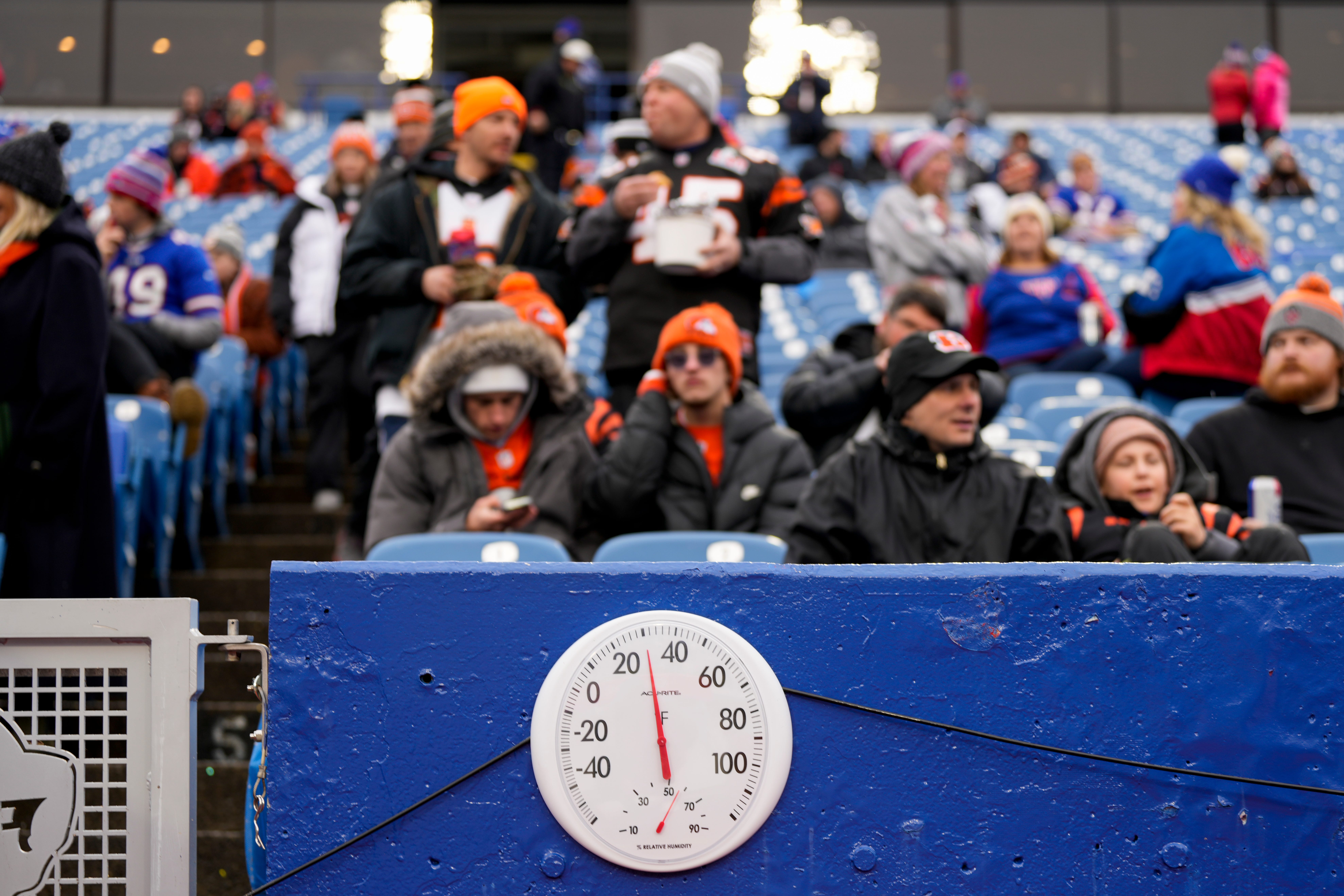 Temperatures hover in the low 30s as snow begins to fall during warmups before the NFL divisional playoff football game between the Cincinnati Bengals and the Buffalo Bills, Sunday, Jan. 22, 2023, at Highmark Stadium in Orchard Park, N.Y. Cincinnati Bengals At Buffalo Bills Afc Divisional