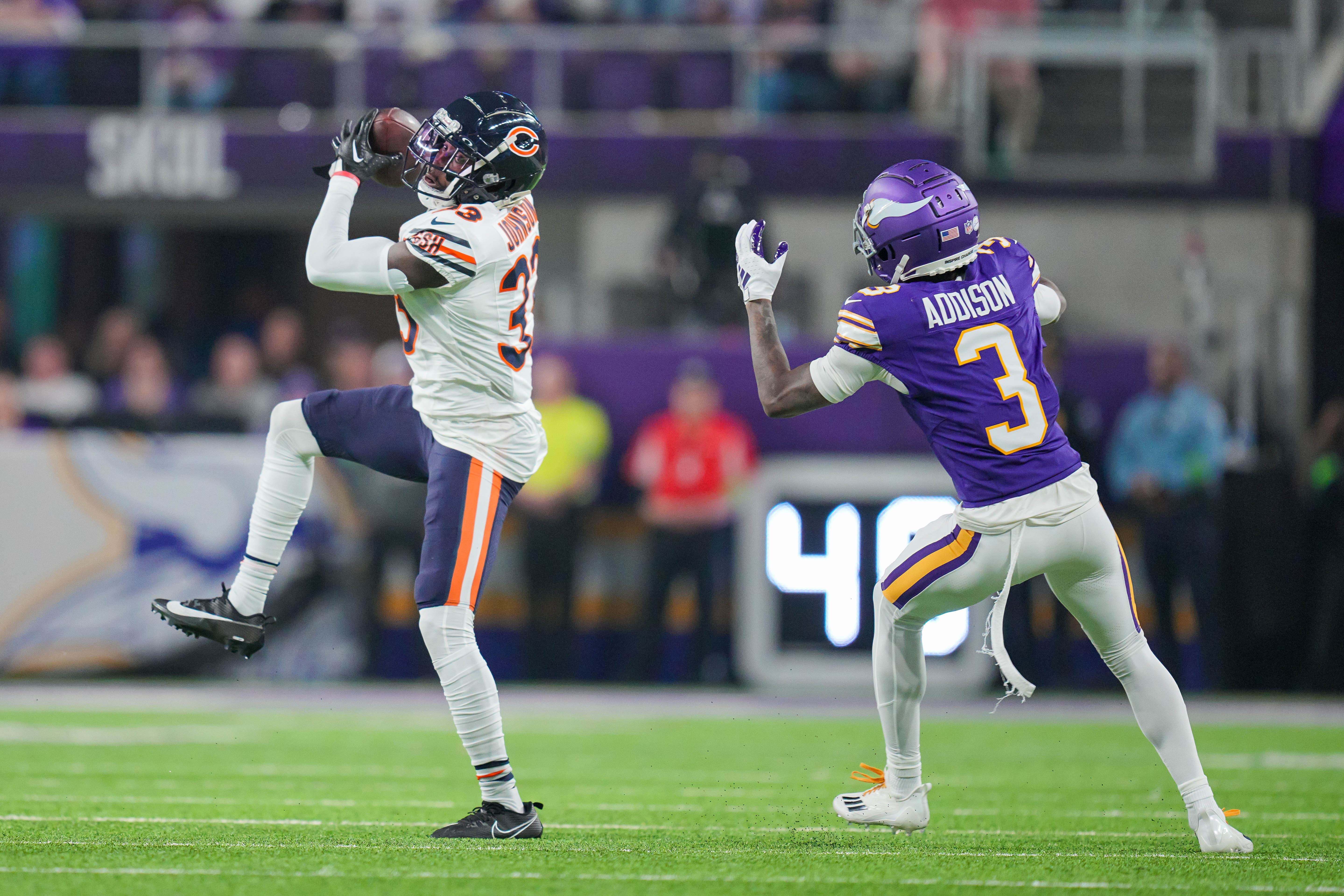 Nov 27, 2023; Minneapolis, Minnesota, USA; Chicago Bears cornerback Jaylon Johnson (33) intercepts a pass intended for Minnesota Vikings wide receiver Jordan Addison (3) in the second quarter at U.S. Bank Stadium.