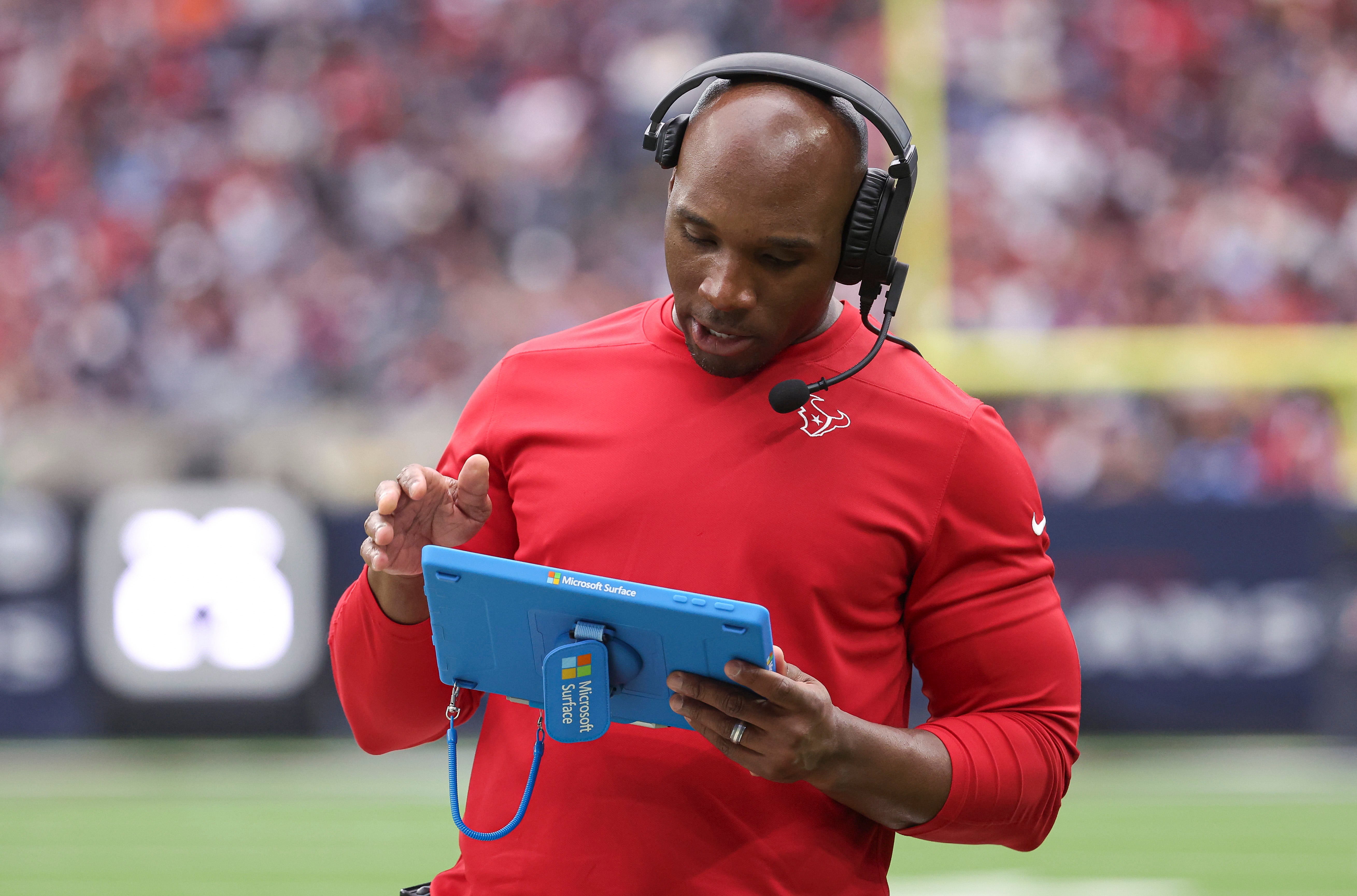 Dec 31, 2023; Houston, Texas, USA; Houston Texans head coach DeMeco Ryans looks at a tablet during the game against the Tennessee Titans at NRG Stadium.