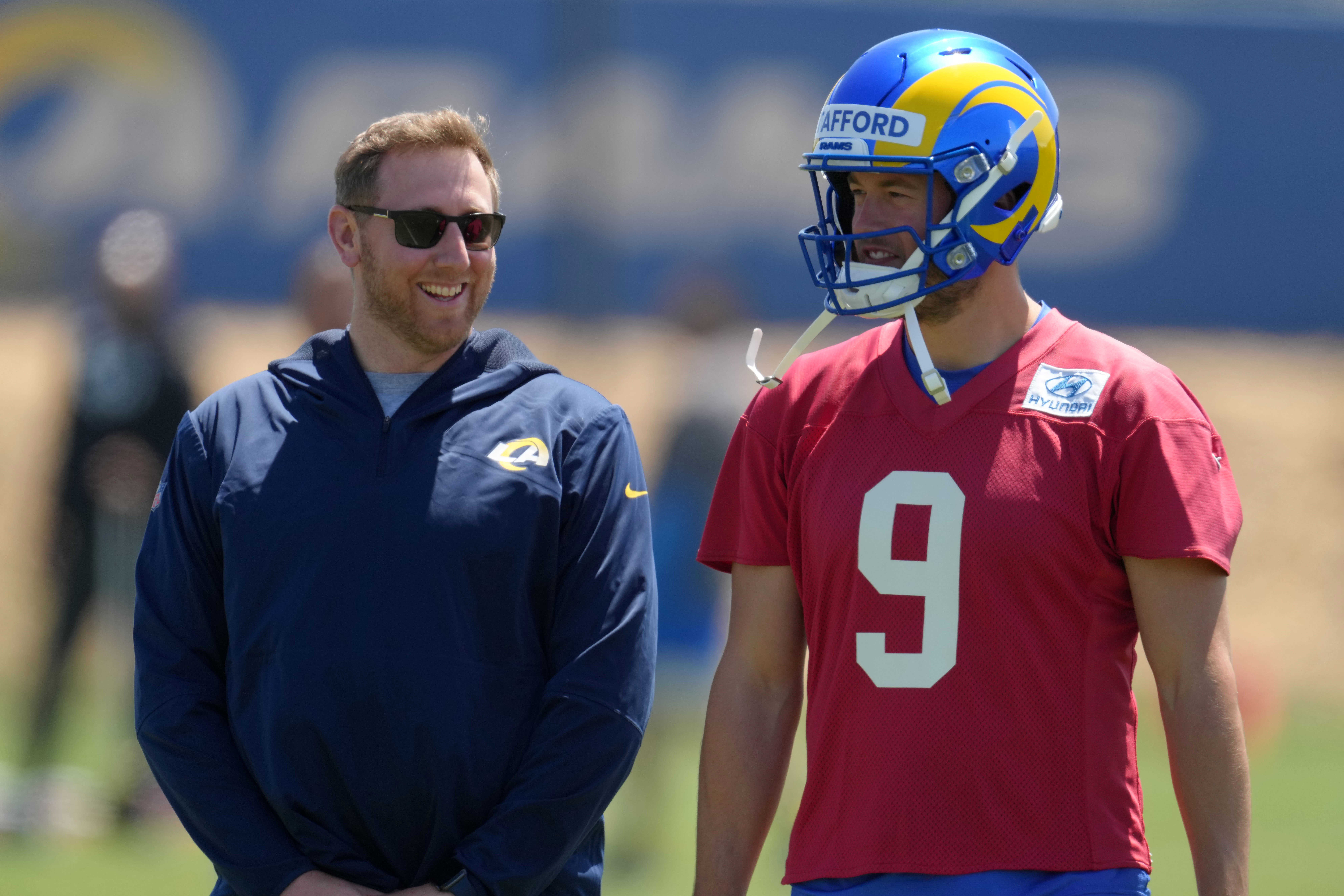 May 23, 2022; Thousand Oaks, CA, USA; Los Angeles Rams offensive coordinator Liam Coen (left) and quarterback Matthew Stafford (9) during organized team activities at California Lutheran University.