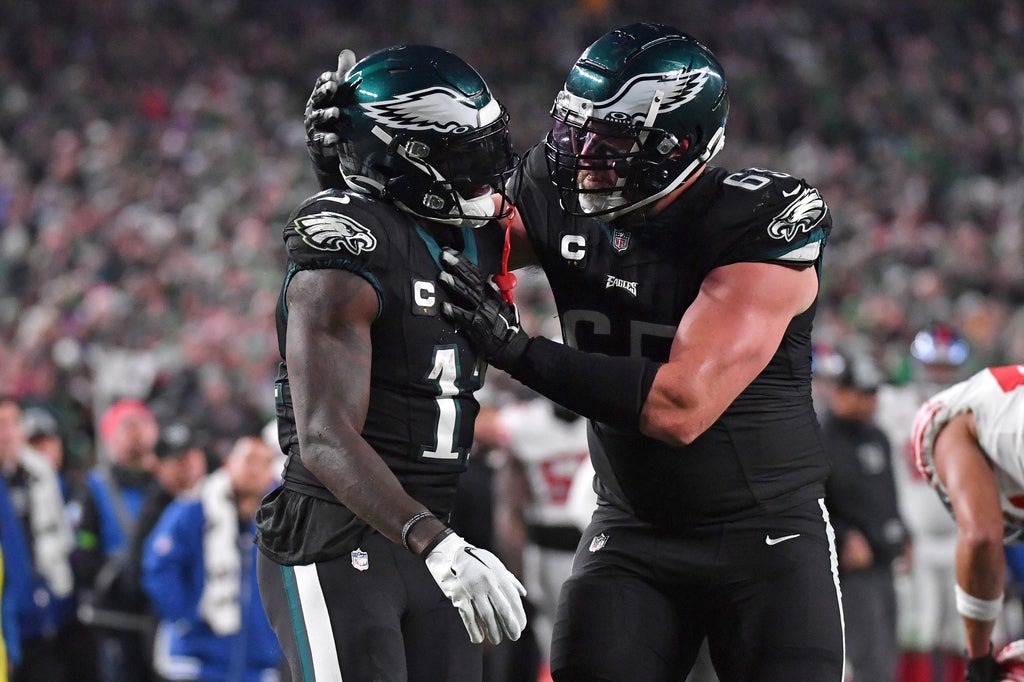Philadelphia Eagles wide receiver A.J. Brown (11) celebrates his catch with offensive tackle Lane Johnson (65) during the fourth quarter against the New York Giants at Lincoln Financial Field.