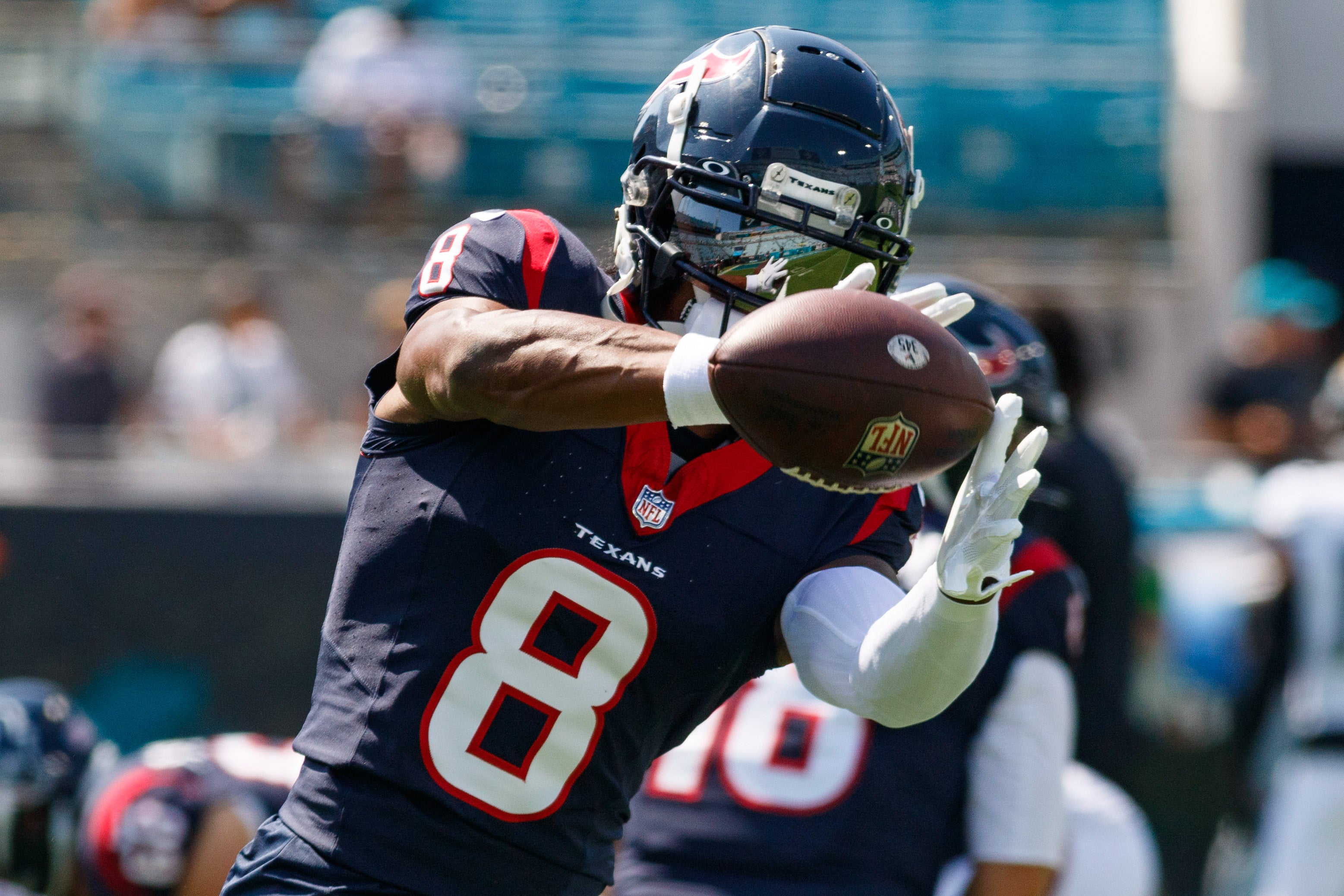 Sep 24, 2023; Jacksonville, Florida, USA; Houston Texans wide receiver John Metchie III (8) catches the ball during the warm ups against the Jacksonville Jaguars at EverBank Stadium.