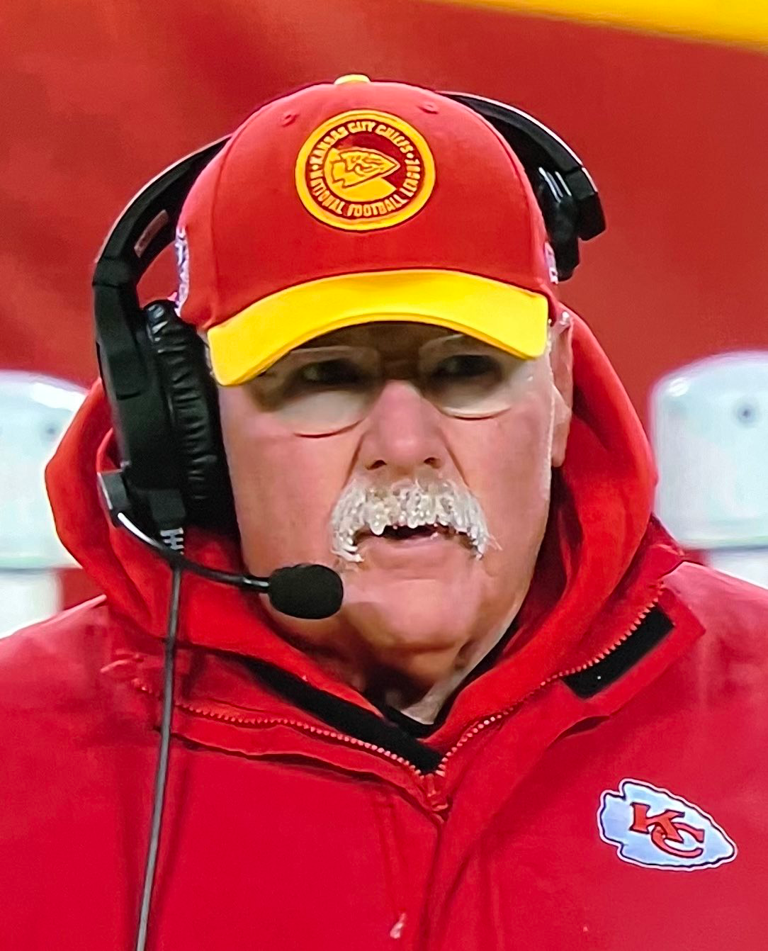 Chiefs head coach Andy Reid with icicles forming on his mustache on the sideline during the team's wildcard playoff game against the Dolphins