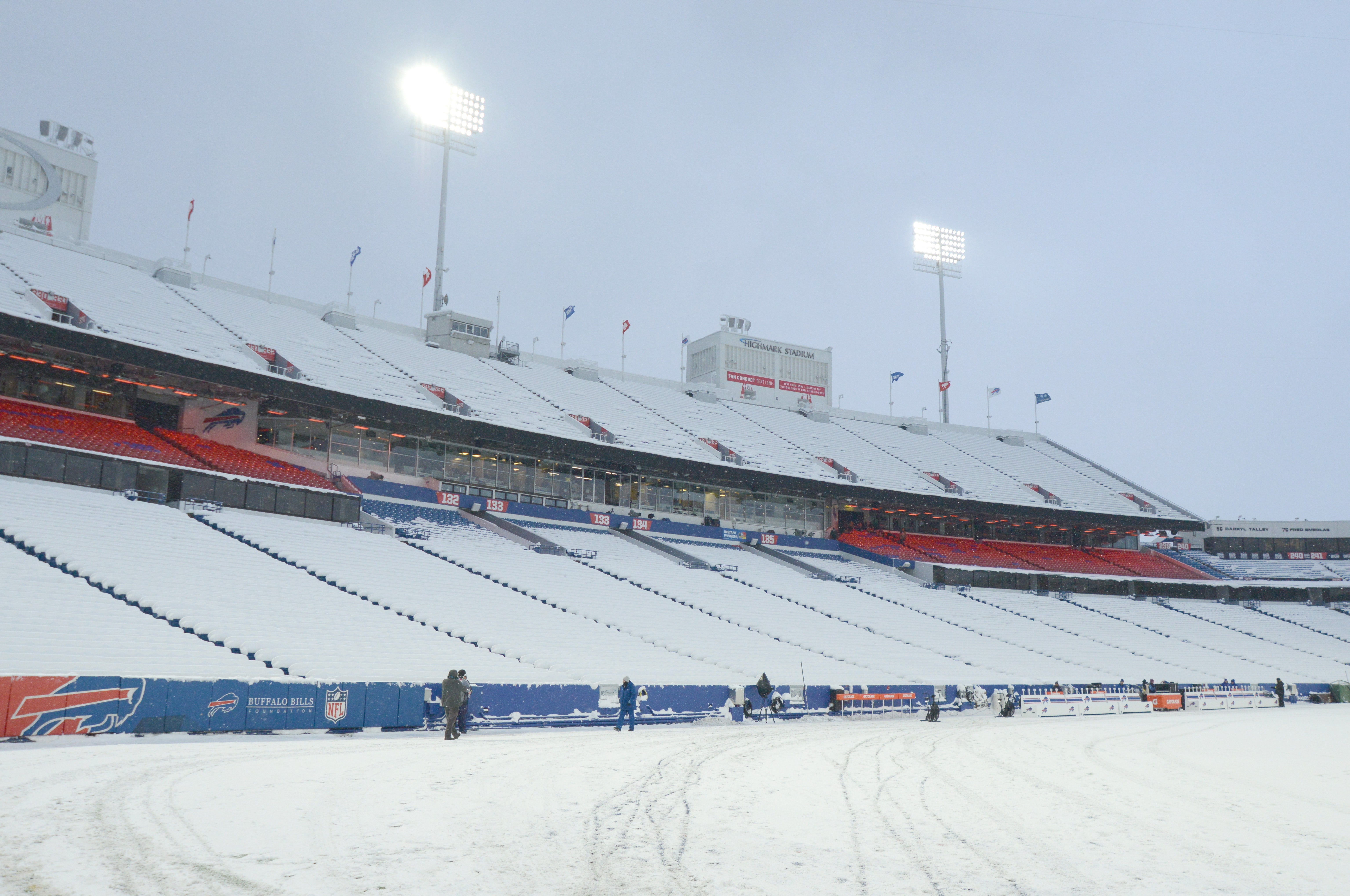 Highmark Stadium seats are covered with snow before a game between the Buffalo Bills and Miami Dolphins