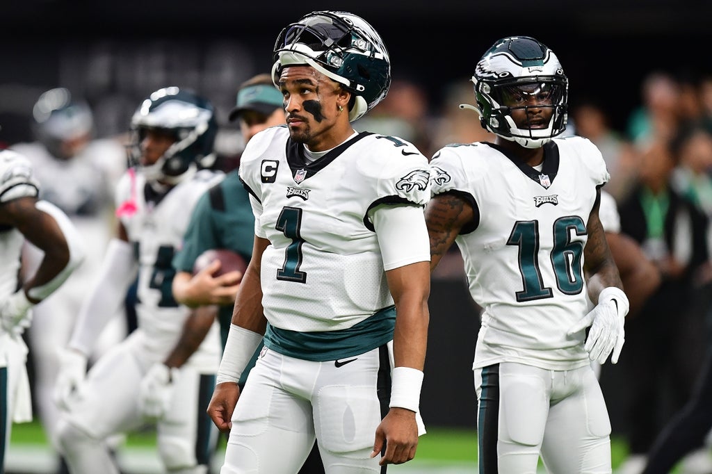 Philadelphia Eagles quarterback Jalen Hurts (1) and wide receiver Quez Watkins (16) before playing against the Las Vegas Raiders at Allegiant Stadium.