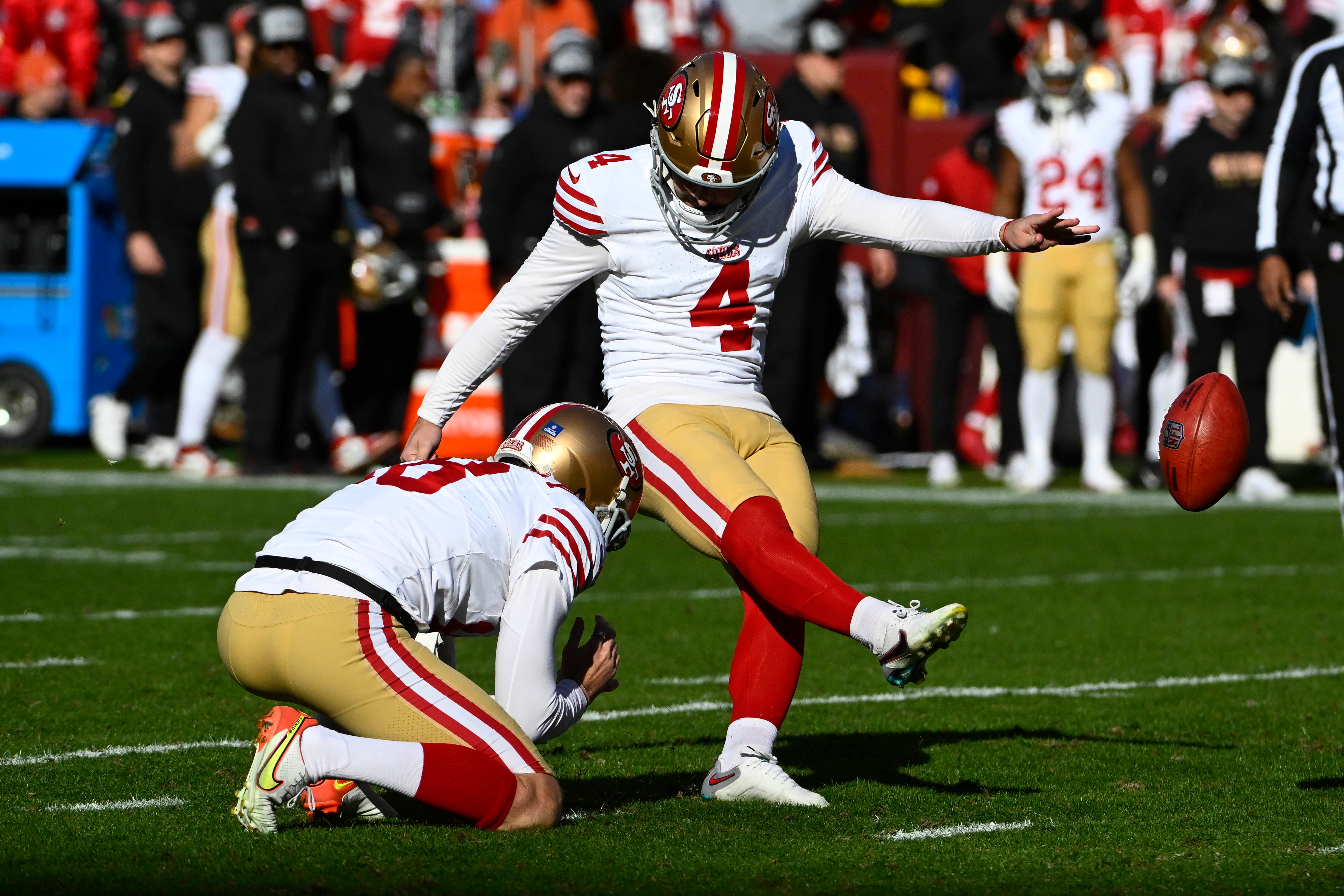Dec 31, 2023; Landover, Maryland, USA; San Francisco 49ers place kicker Jake Moody (4) kicks a field goal against the Washington Commanders during the first half at FedExField.