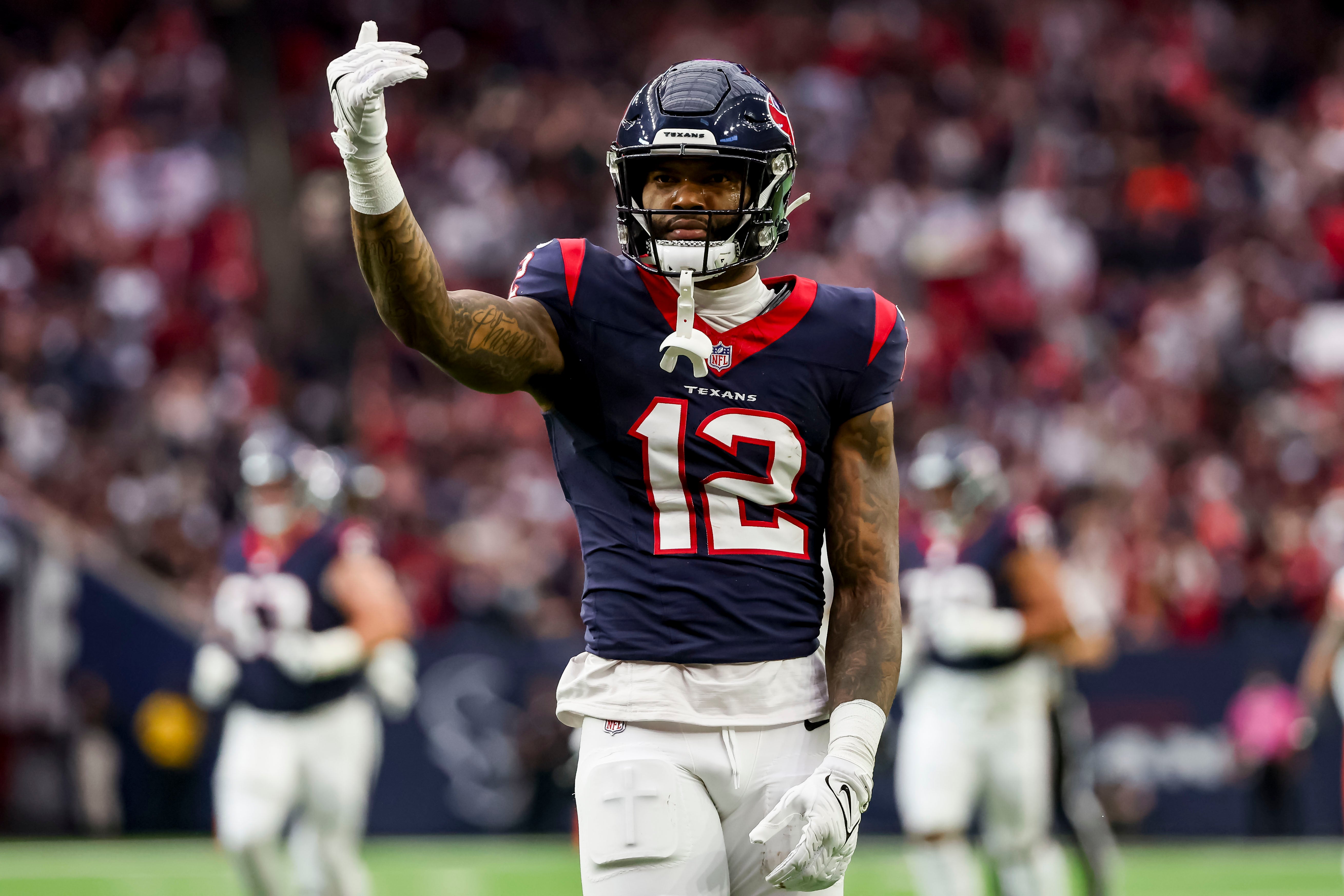 Jan 13, 2024; Houston, Texas, USA; Houston Texans wide receiver Nico Collins (12) celebrates catching the ball during the first quarter in a 2024 AFC wild card game at NRG Stadium.