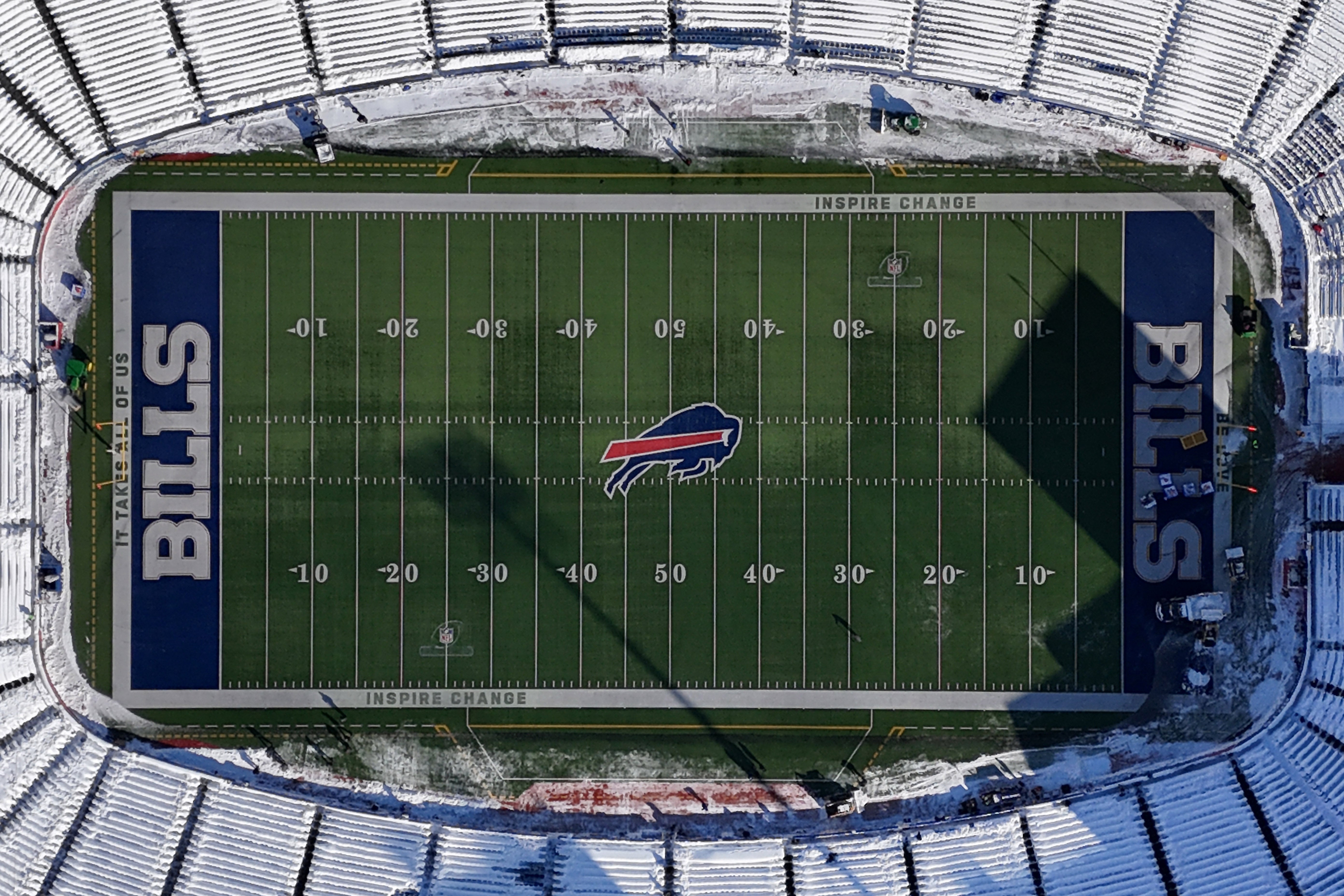 A general overall view of the Buffalo Bills logo at midfield of a snow-covered Highmark Stadium during a 2024 AFC wild card game between the Pittsburgh Steelers and the Buffalo Bills.