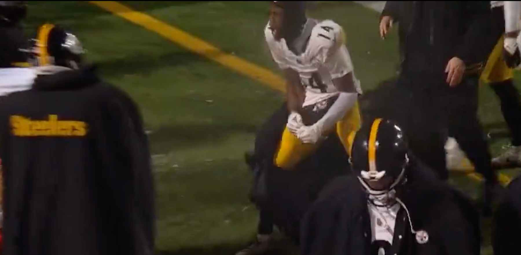 Pittsburgh Steelers WR George Pickens throws his helmet in frustration following loss on Wildcard weekend at Bills