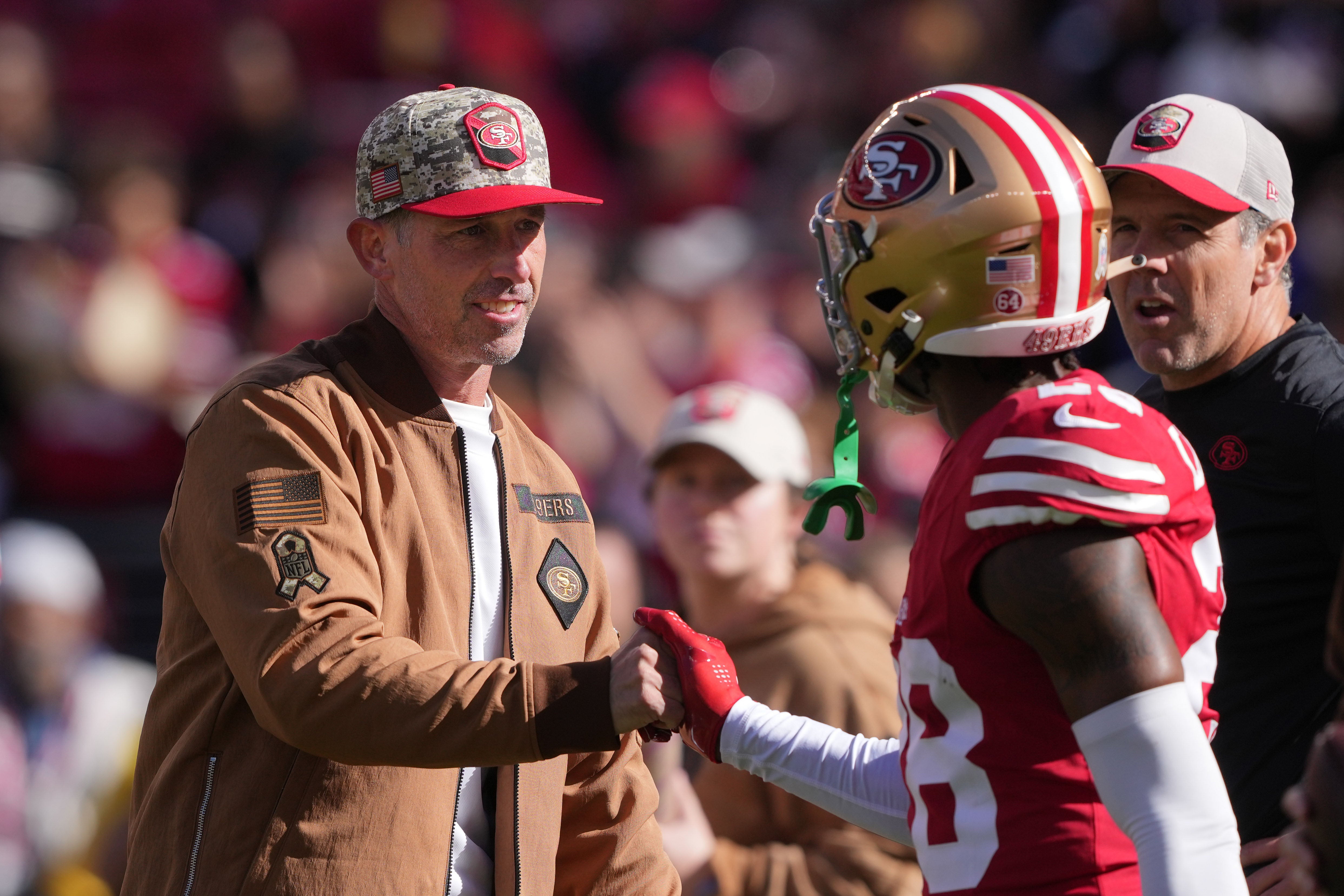 Nov 19, 2023; Santa Clara, California, USA; San Francisco 49ers head coach Kyle Shanahan (left) greets cornerback Darrell Luter Jr. (right) before the game against the Tampa Bay Buccaneers at Levi's Stadium.