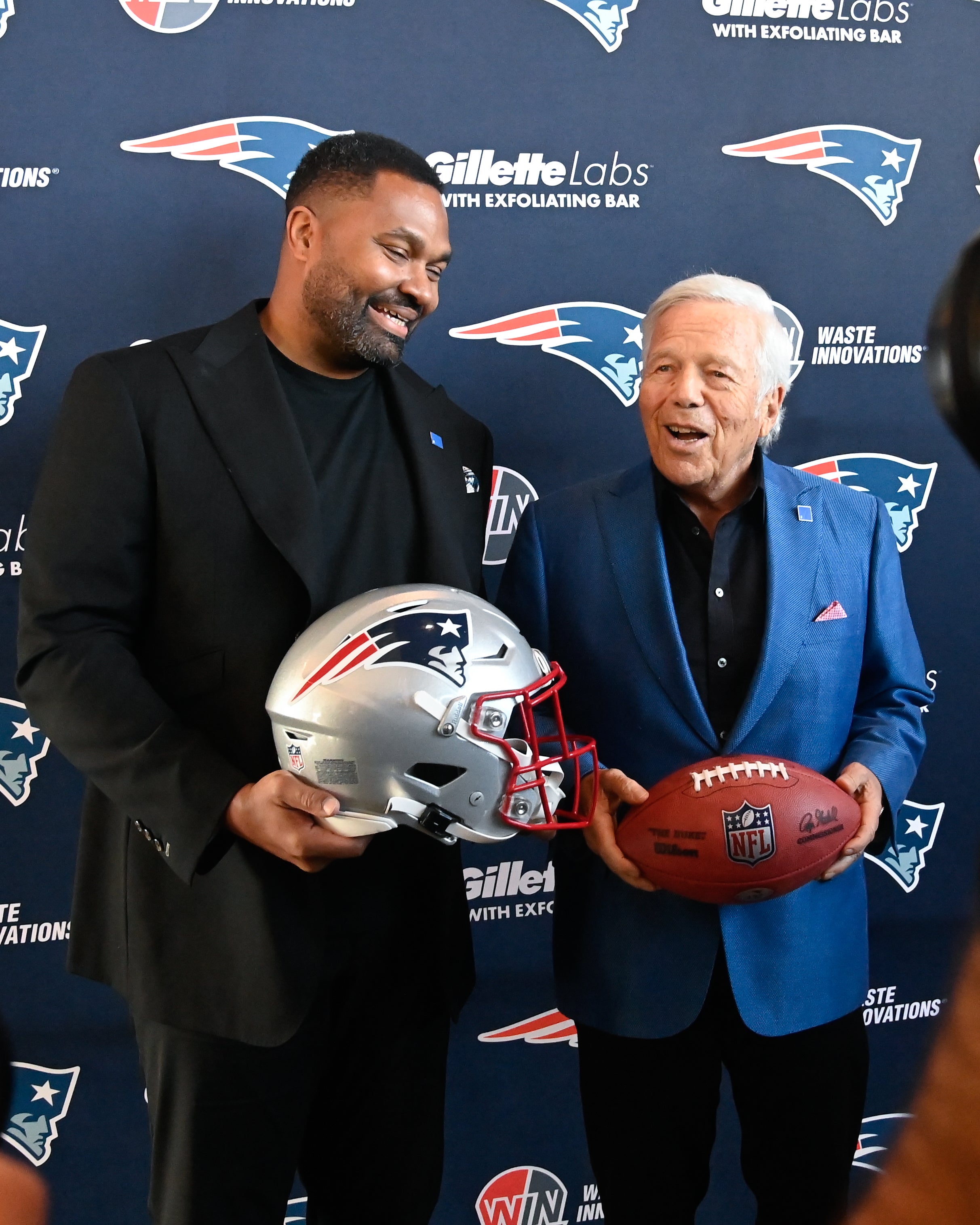 New England Patriots head coach Jerod Mayo and owner Robert Kraft pose for photos after a press conference announcing Mayo's hiring as the team's head coach at Gillette Stadium.