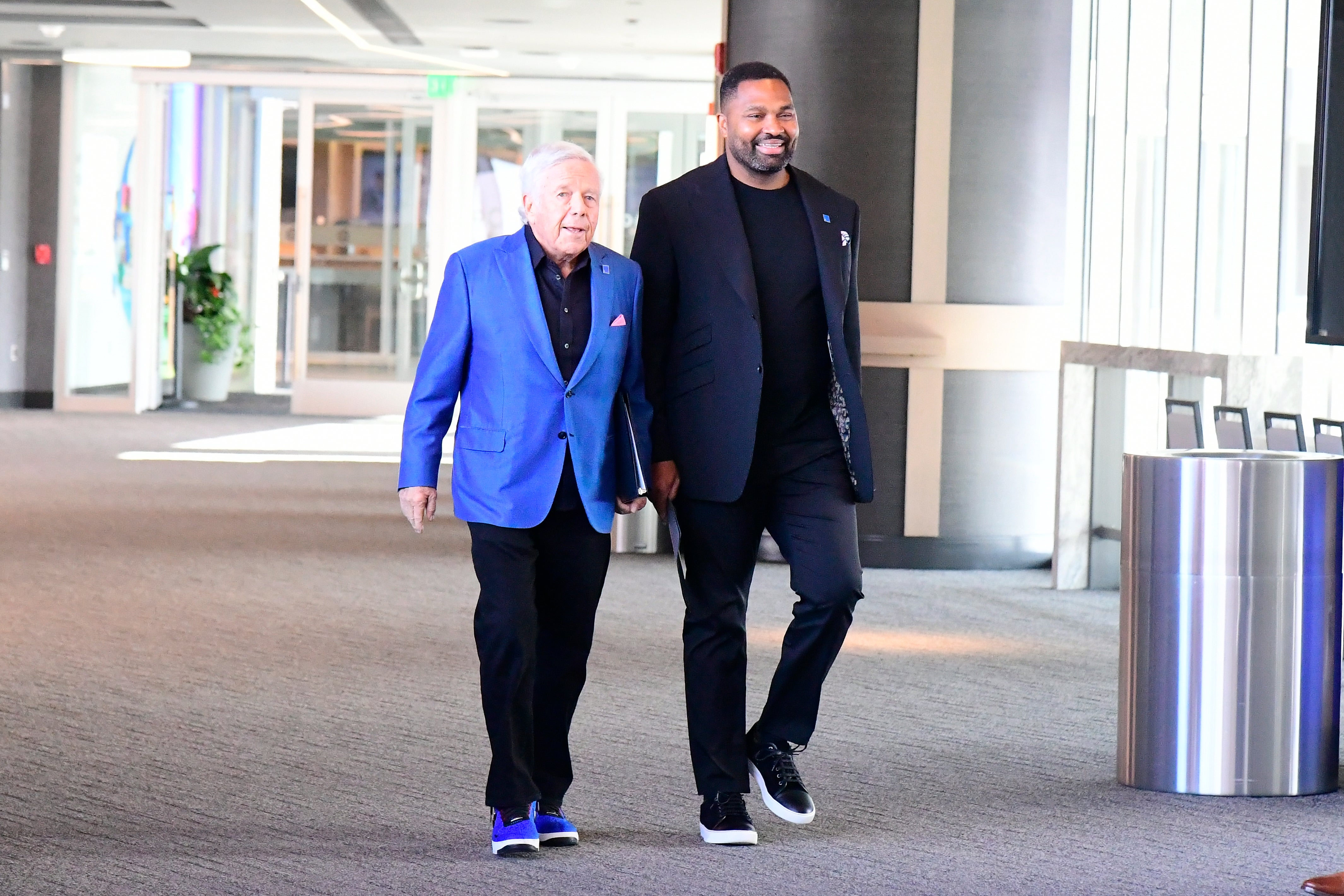 New England Patriots owner Robert Kraft and head coach Jerod Mayo enter the auditorium for a press conference to announce Mayo's hiring as head coach at Gillette Stadium.