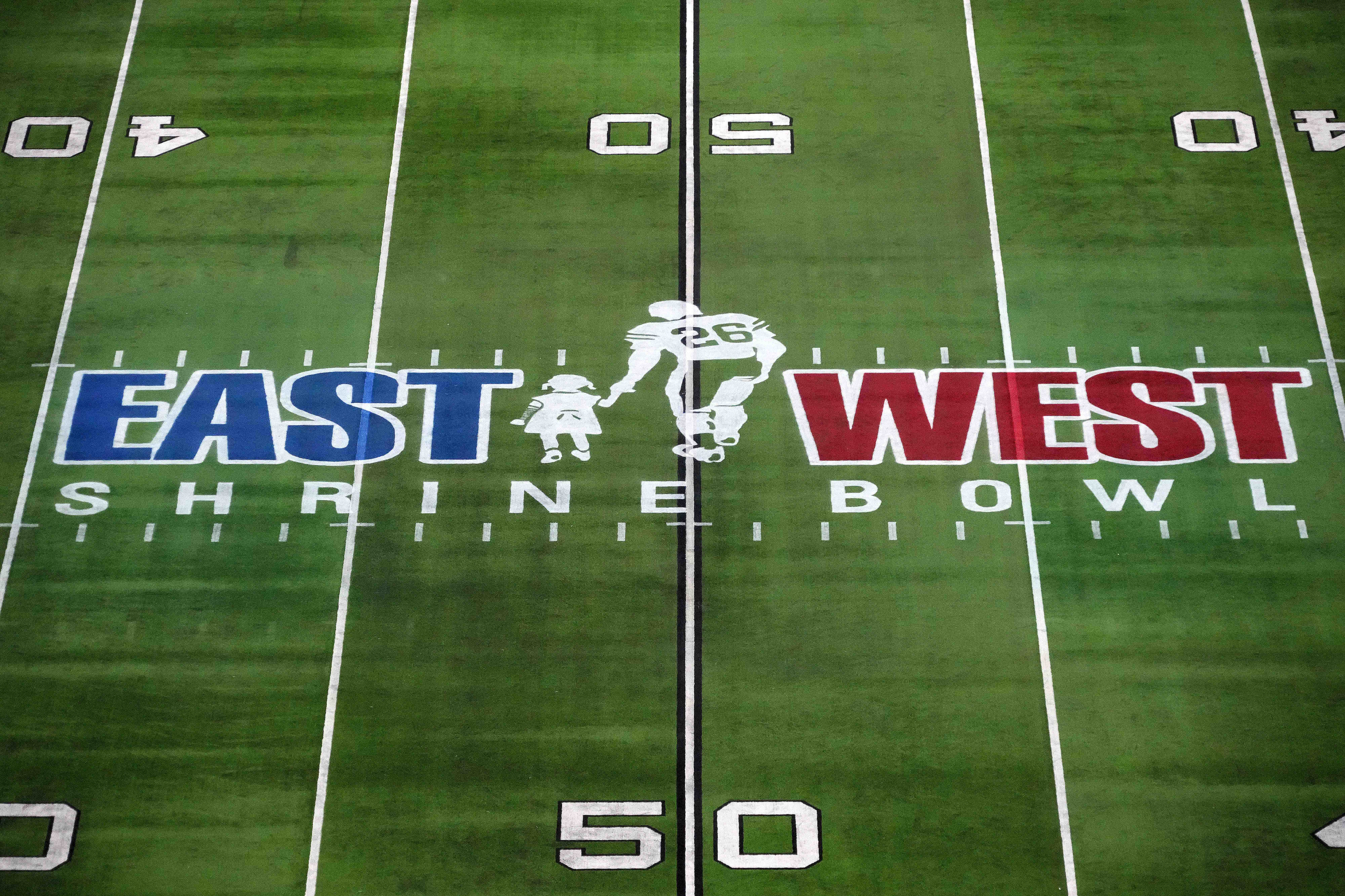 Feb 2, 2023; Las Vegas, NV, USA; The East-West Shrine logo at midfield during the Shrine Bowl at Allegiant Stadium.