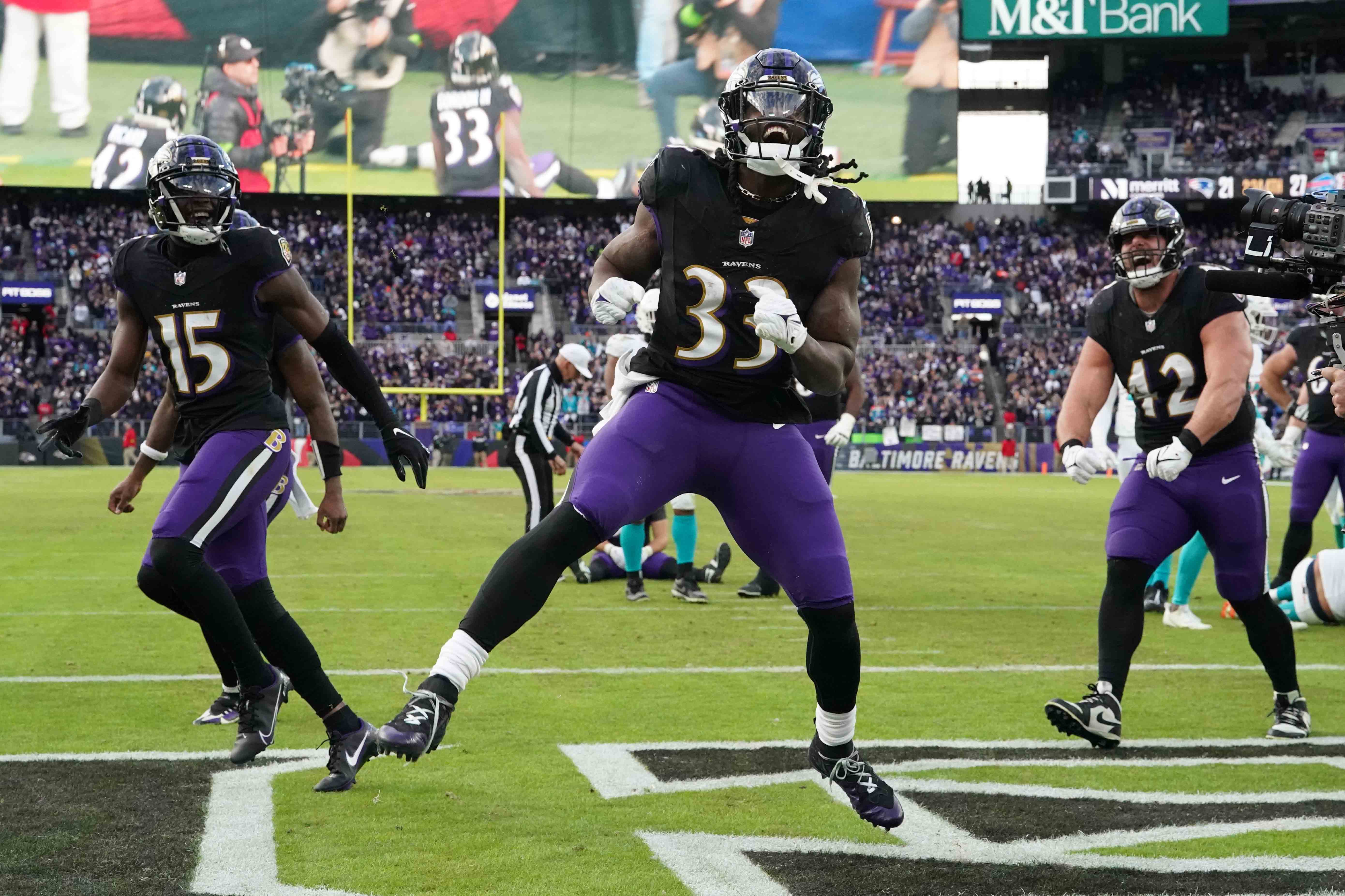 Baltimore Ravens running back Melvin Gordon III (33) reacts following his fourth quarter touchdown run against the Miami Dolphins at M&T Bank Stadium.