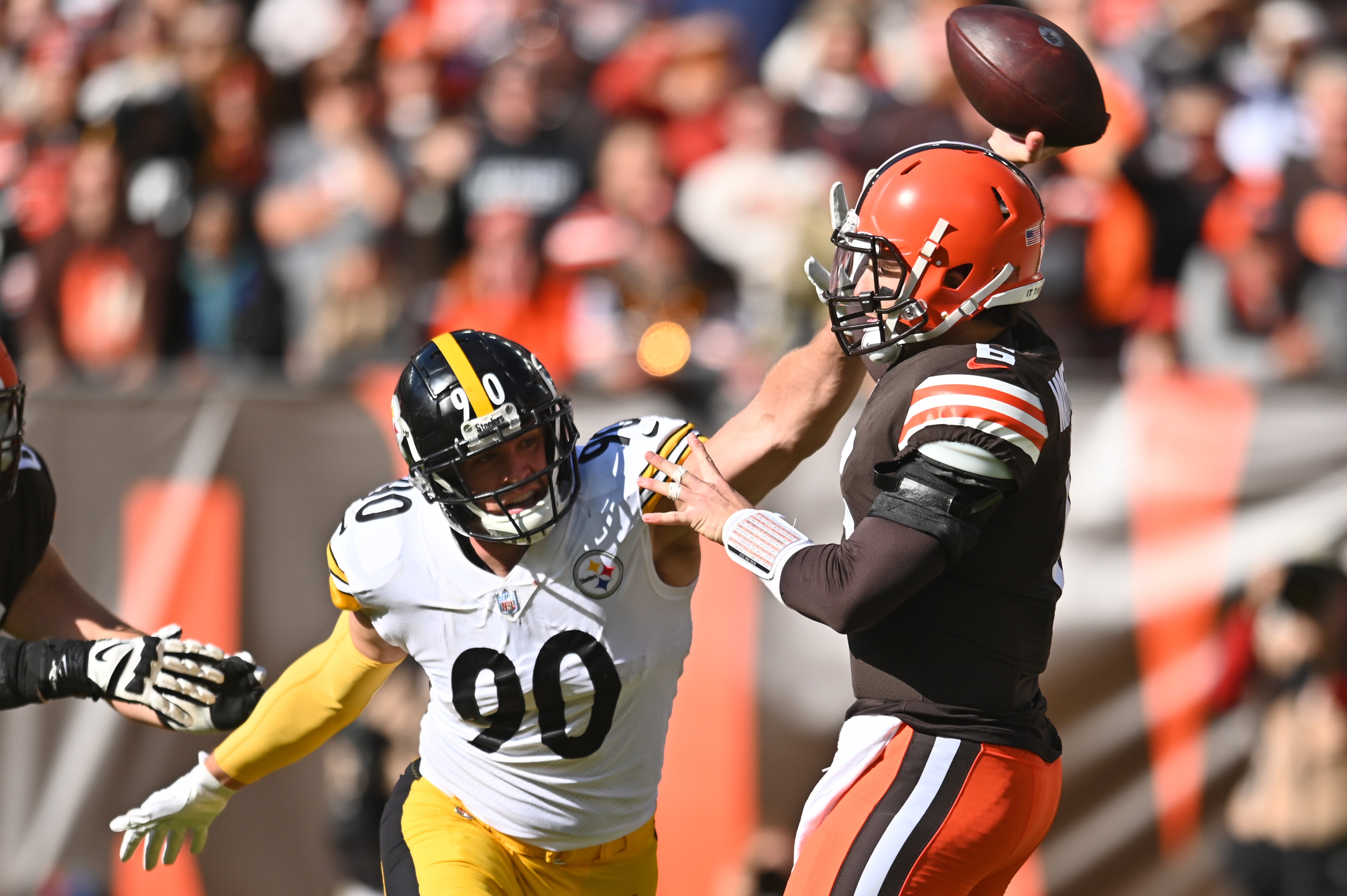 Oct 31, 2021; Cleveland, Ohio, USA; Cleveland Browns quarterback Baker Mayfield (6) throws a pass under pressure from Pittsburgh Steelers outside linebacker T.J. Watt (90) during the first half at FirstEnergy Stadium. Mandatory Credit: Ken Blaze-USA TODAY Sports