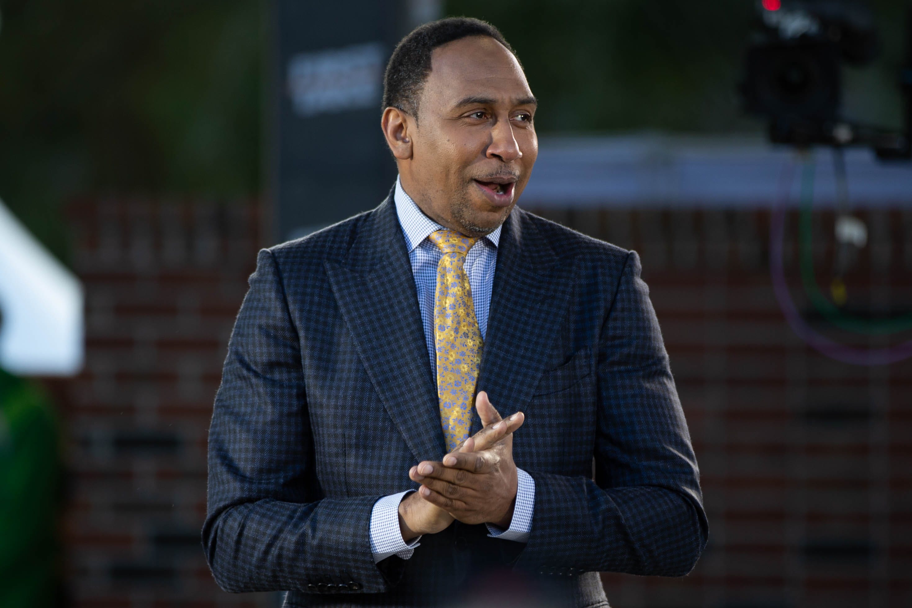 Sports commentator Stephen A. Smith is welcomed by the crowd during a live taping of ESPN's "First Take" at Florida A&M University's new Will Packer Performing Arts Amphitheater as part of the school's homecoming festivities