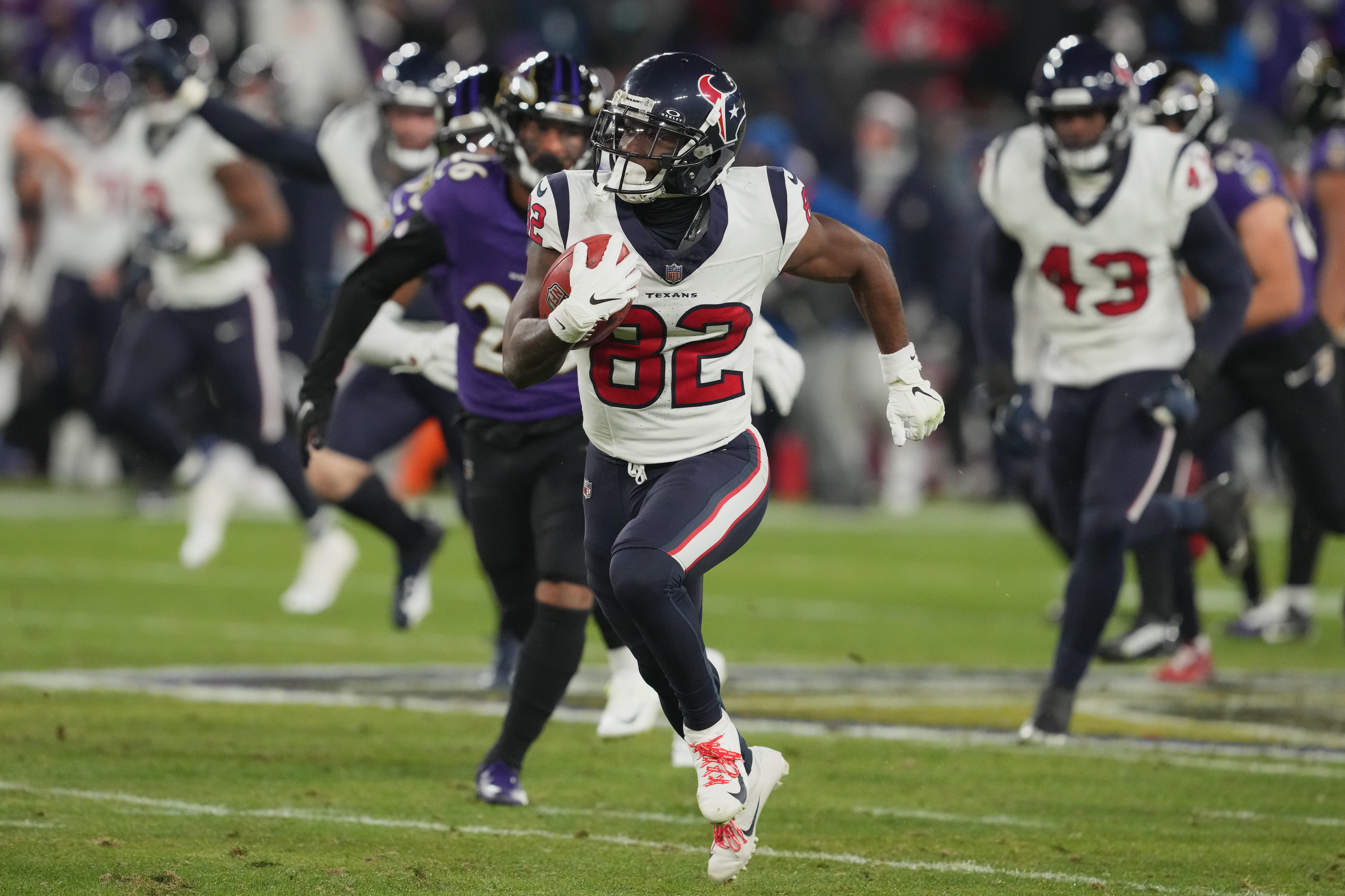 Jan 20, 2024; Baltimore, MD, USA; Houston Texans wide receiver Steven Sims (82) returns a punt for a touchdown against the Baltimore Ravens during the second quarter of a 2024 AFC divisional round game at M&T Bank Stadium.