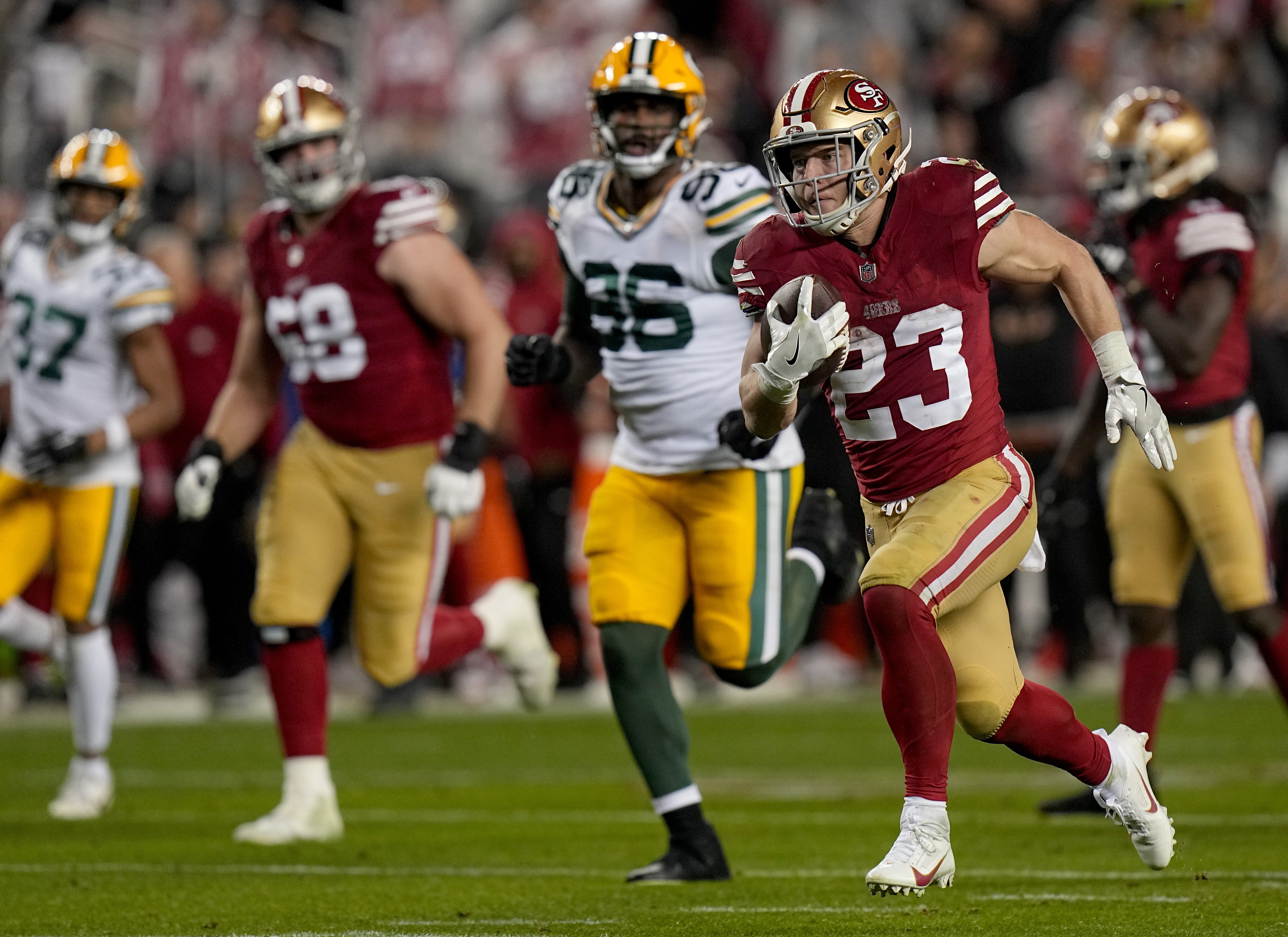 San Francisco 49ers running back Christian McCaffrey (23) scores a touchdown on a 39-yard run during the third quarter of their NFC divisional playoff game Saturday, January 20, 2024 at Levi Stadium in Santa Clara, California. The San Francisco 49ers beat the Green Bay Packers 24-21.