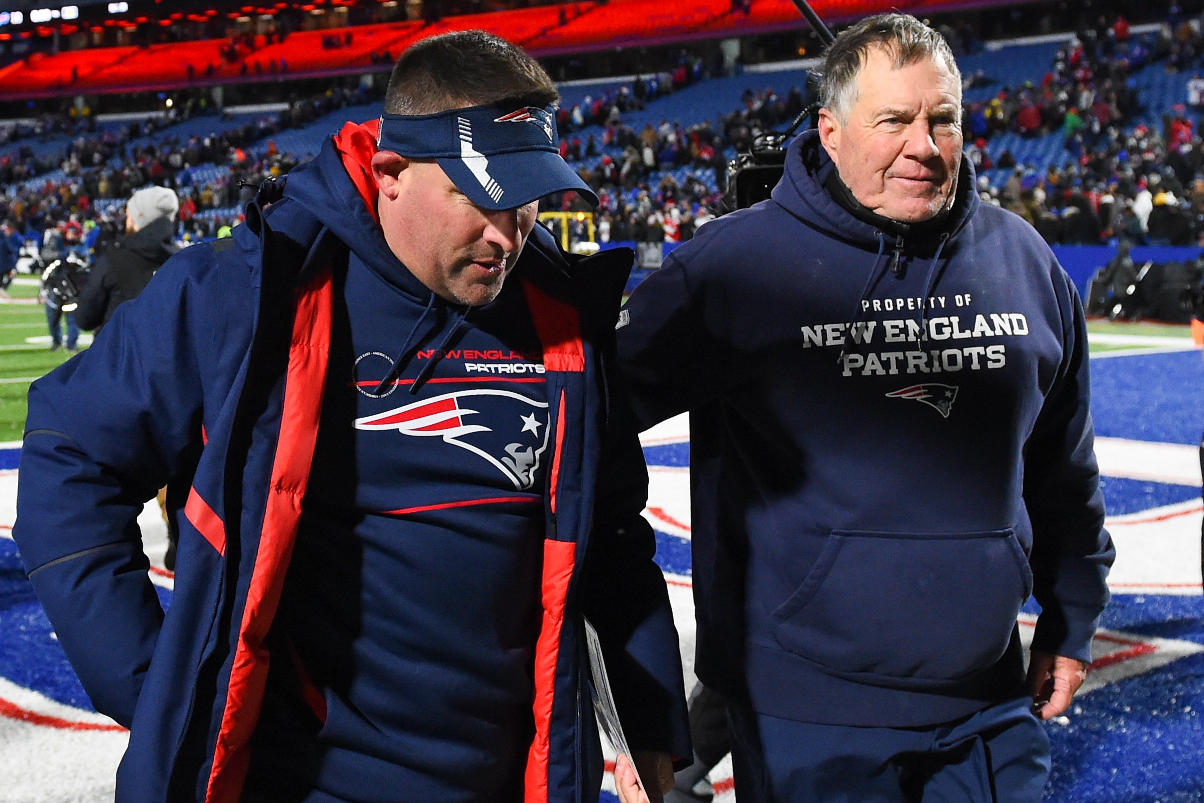 New England Patriots offensive coordinator Josh McDaniels and head coach Bill Belichick walk off the field following the game against the Buffalo Bills at Highmark Stadium.
