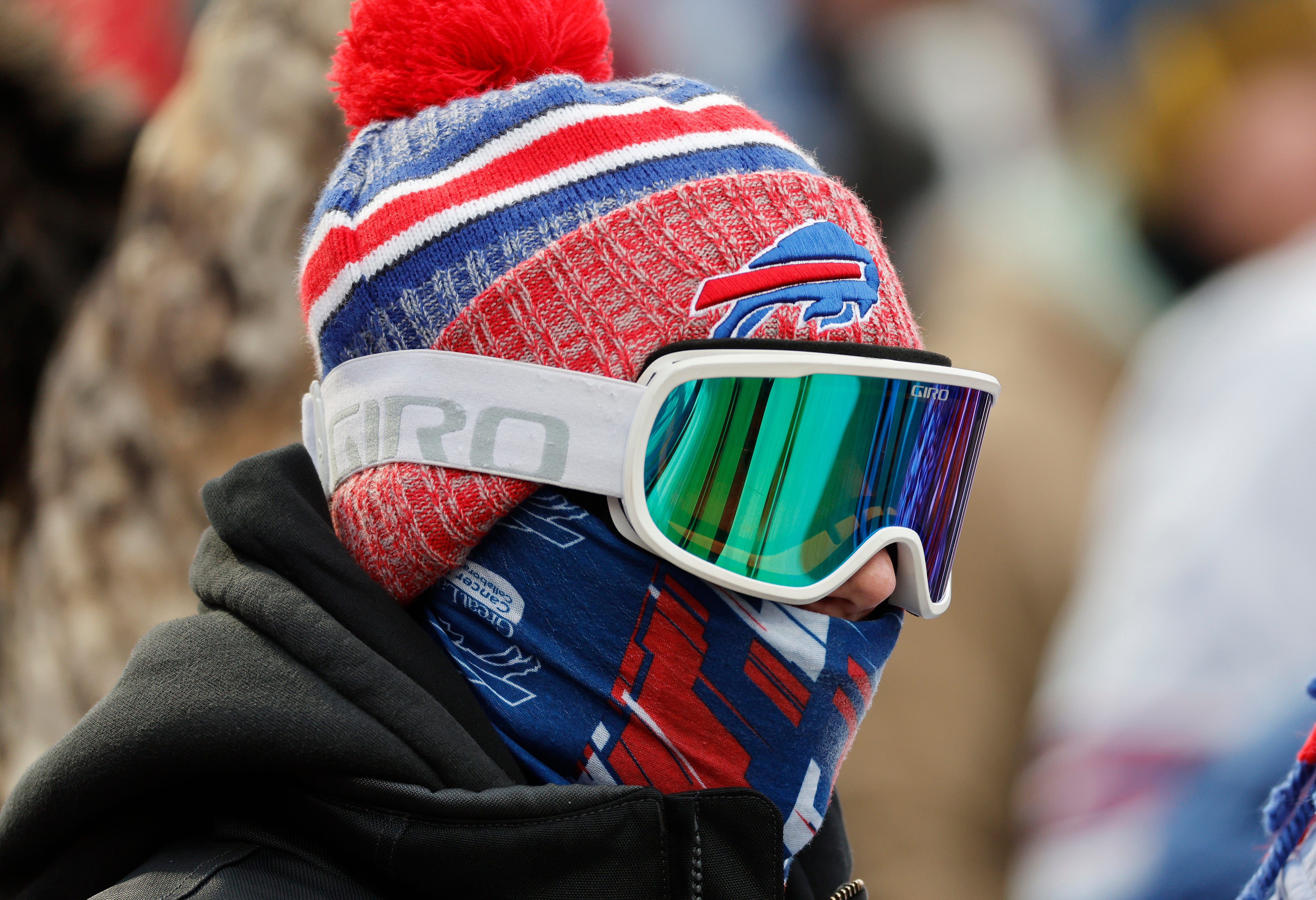 A bundled up fan fights the cold at Highmark Stadium