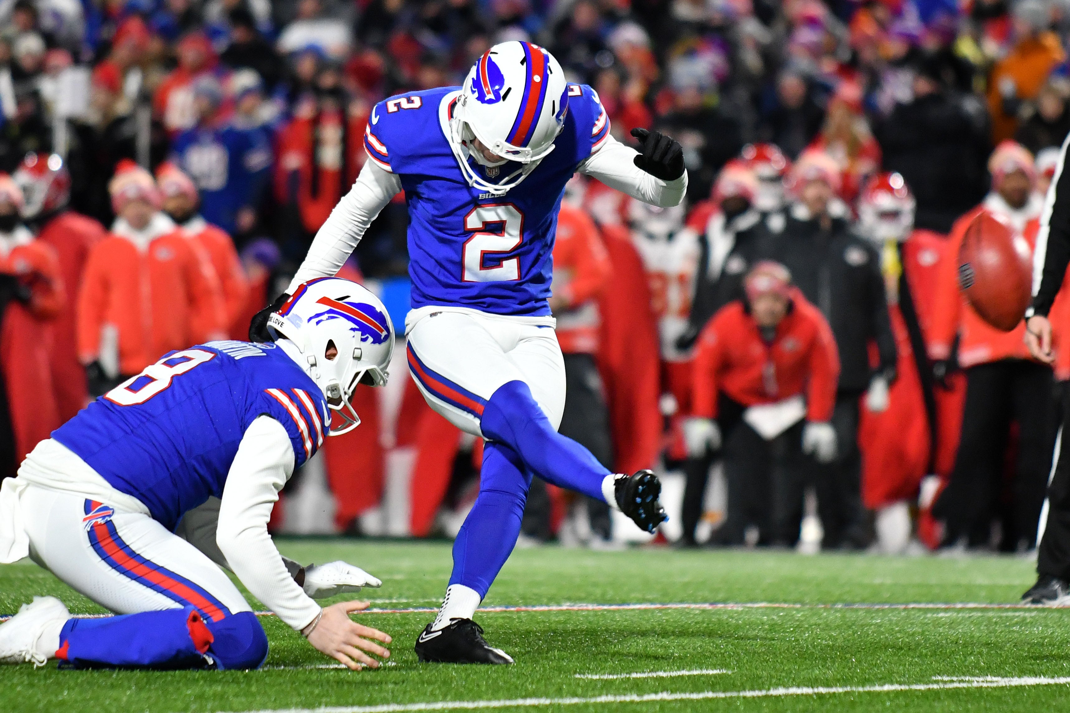 Jan 21, 2024; Orchard Park, New York, USA; Buffalo Bills place kicker Tyler Bass (2) kicks a field goal against the Kansas City Chiefs in the first half of the 2024 AFC divisional round game at Highmark Stadium.