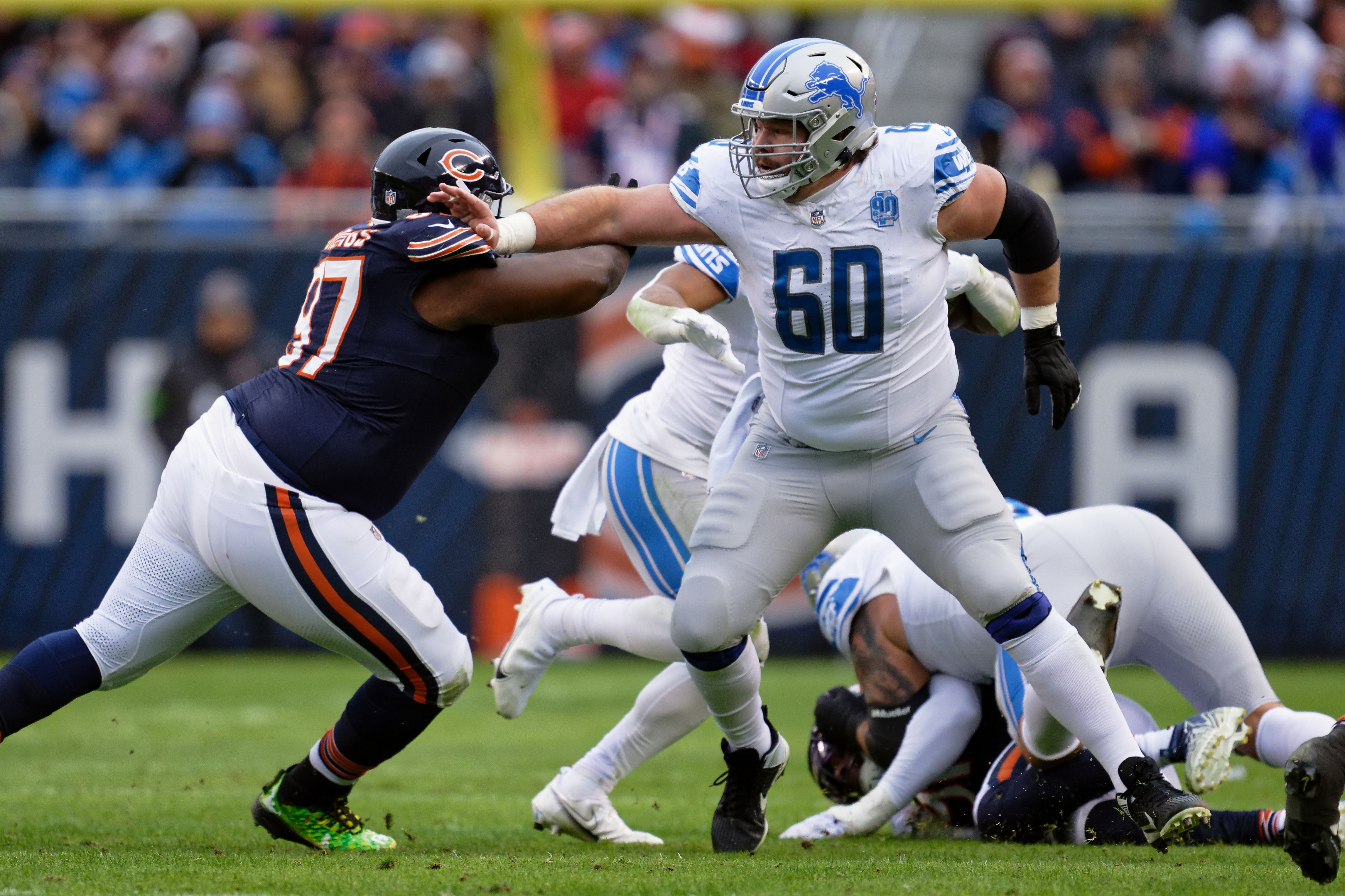 Dec 10, 2023; Chicago, Illinois, USA; Detroit Lions offensive lineman Graham Glasgow (60) blocks against the Chicago Bears at Soldier Field.