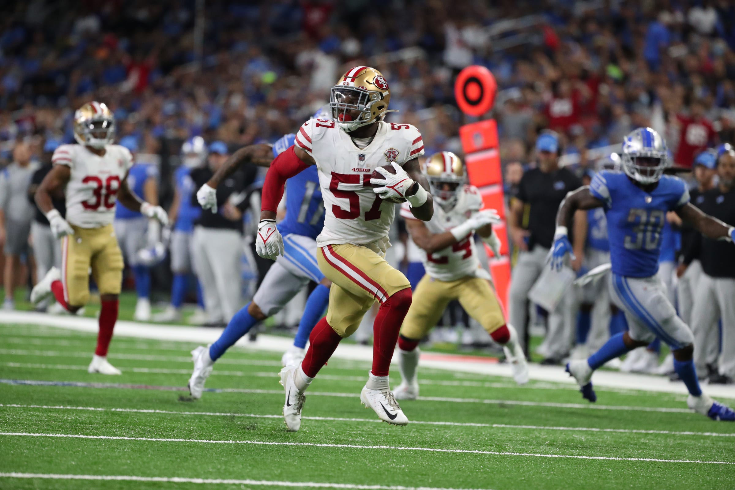 San Francisco 49ers linebacker Dre Greenlaw (57) returns an interception for a touchdown against the Detroit Lions on Sunday, September 12, 2021 at Ford Field. Lions 49ers Sad Detroit Lions