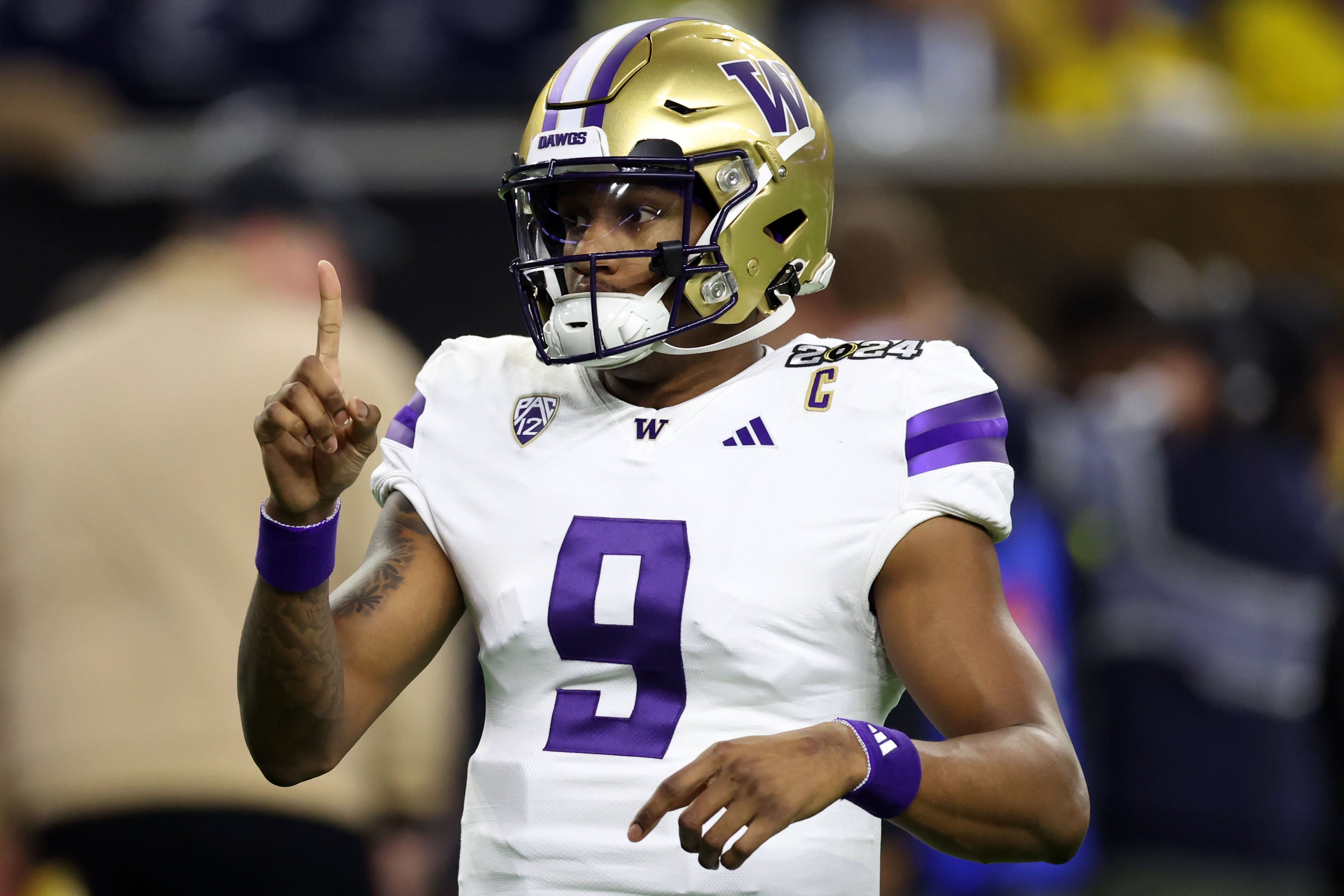 Jan 8, 2024; Houston, TX, USA; Washington Huskies quarterback Michael Penix Jr. (9) during warmups before the start of the 2024 College Football Playoff national championship game at NRG Stadium.