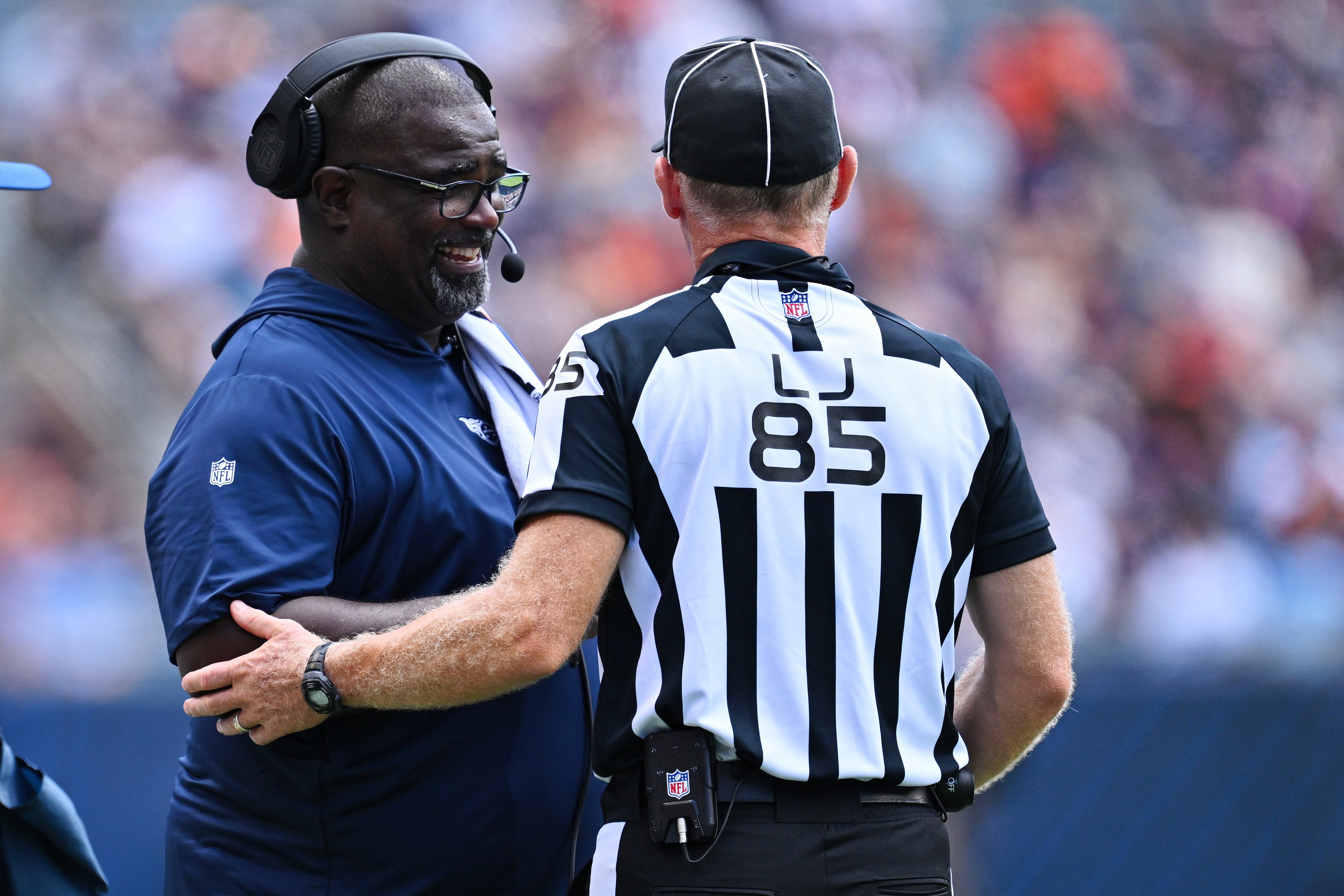 Aug 12, 2023; Chicago, Illinois, USA; Tennessee Titans Assistant Head Coach Terrell Williams talks with Line Judge Daniel Gallagher (85) in the second half against the Chicago Bears at Soldier Field.