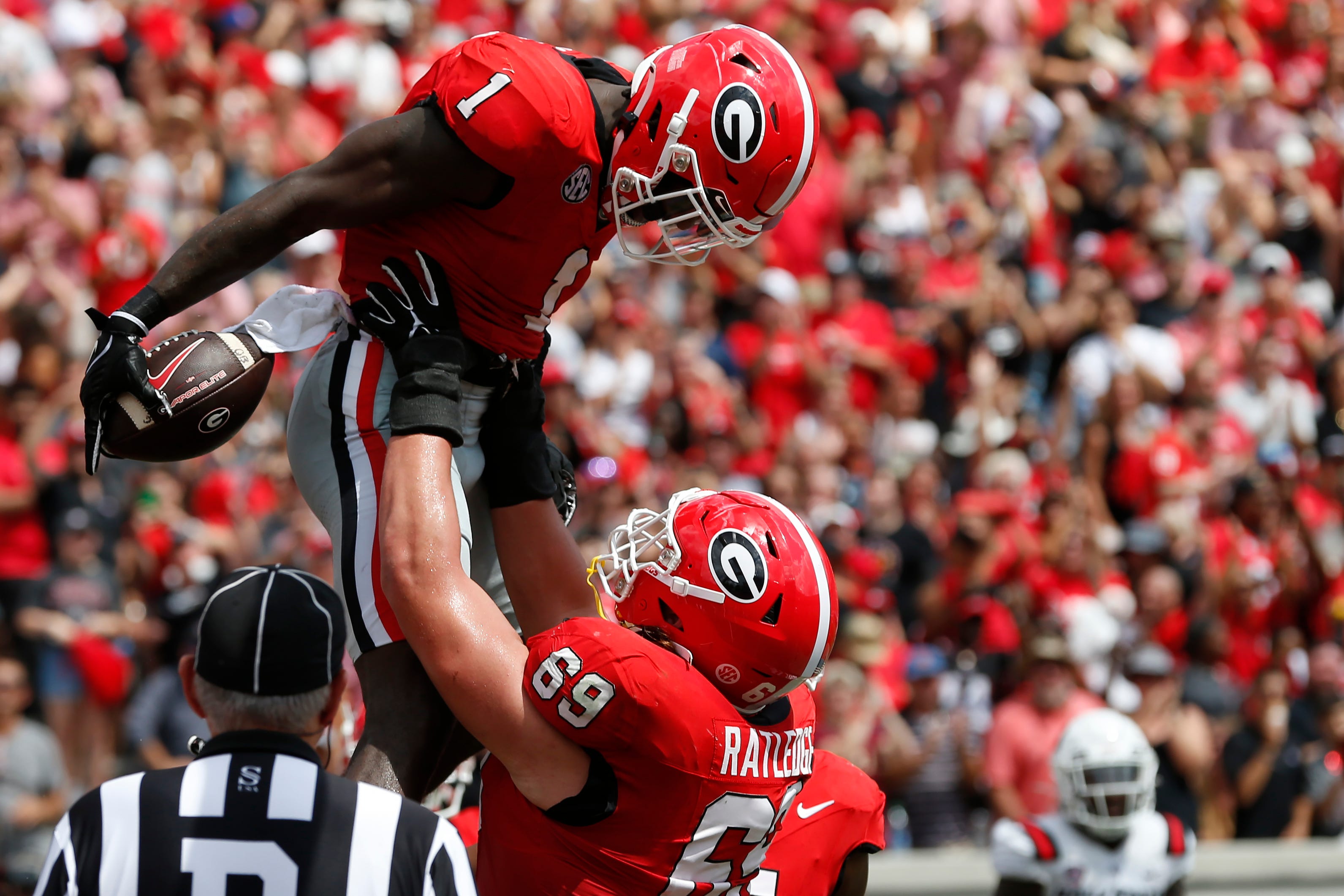 Georgia wide receiver Marcus Rosemy-Jacksaint (1) celebrates with Georgia offensive lineman Tate Ratledge (69) after scoring a touchdown during the first half of a NCAA college football game against Ball State in Athens, Ga., on Saturday, Sept. 9, 2023.