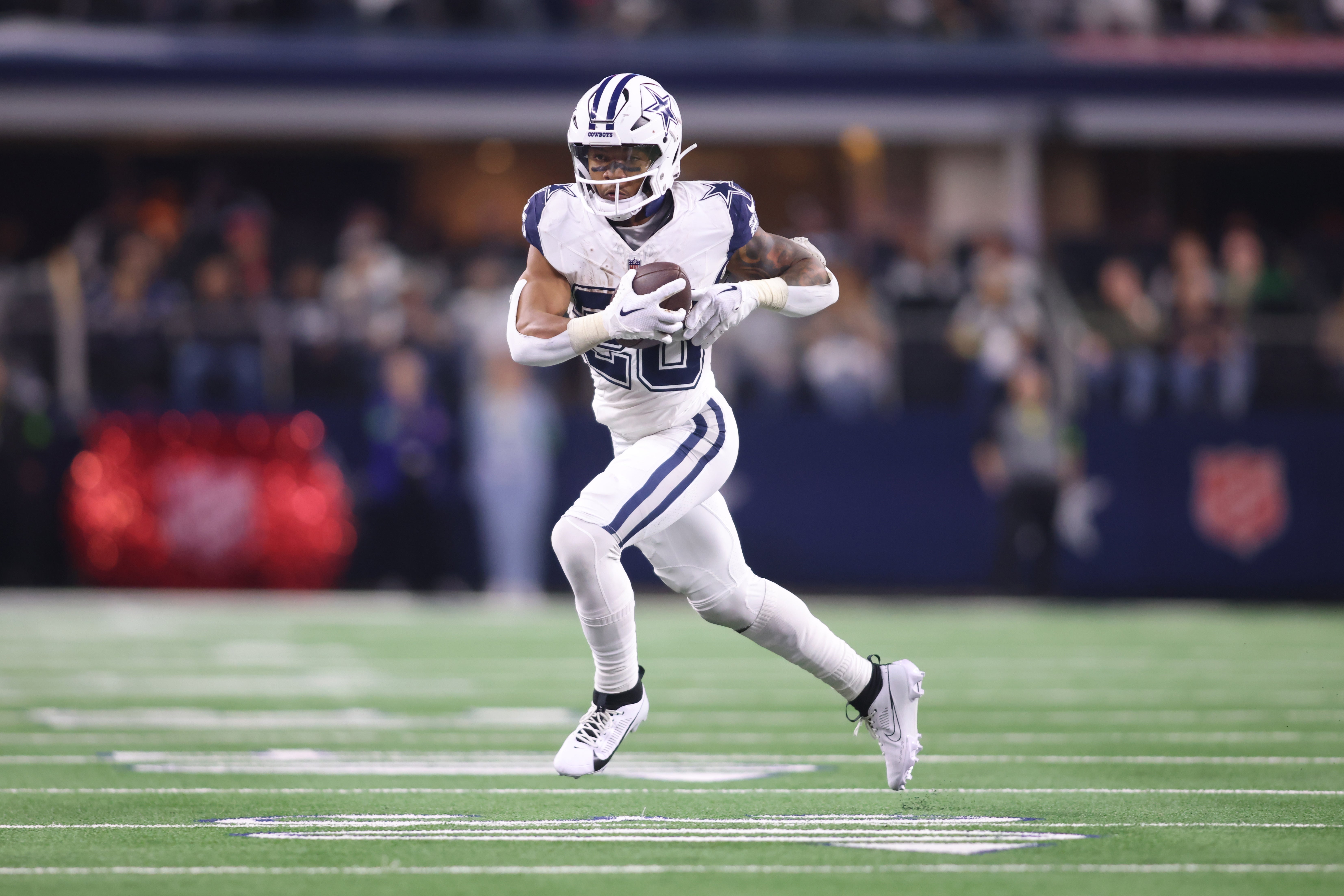 Dallas Cowboys running back Tony Pollard (20) runs the ball against the Philadelphia Eagles in the game at AT&T Stadium.