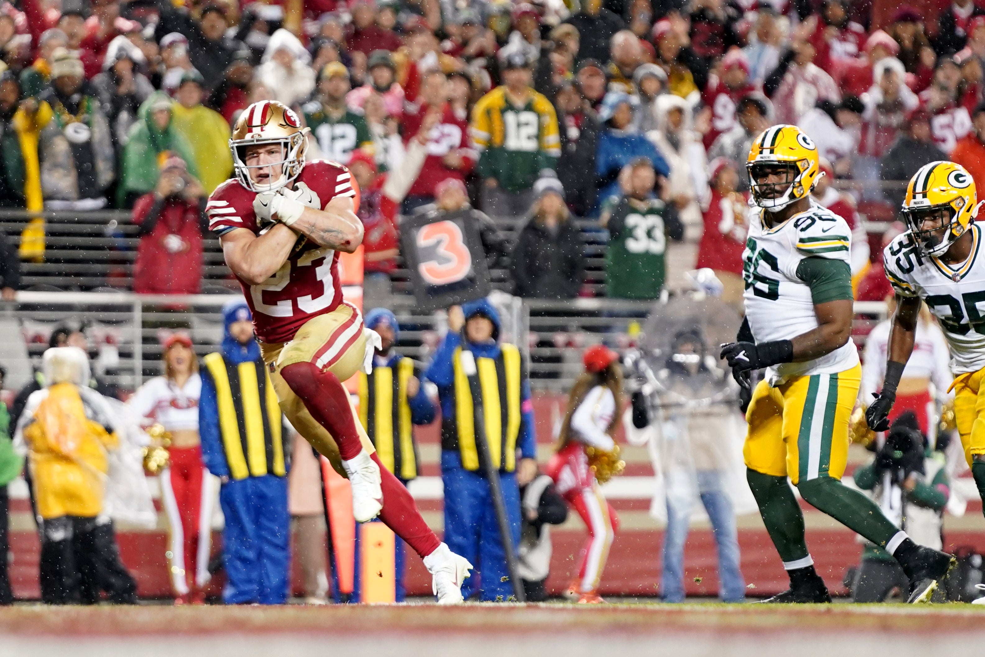 January 20, 2024; Santa Clara, CA, USA; San Francisco 49ers running back Christian McCaffrey (23) runs for a touchdown during the fourth quarter in a 2024 NFC divisional round game at Levi's Stadium.