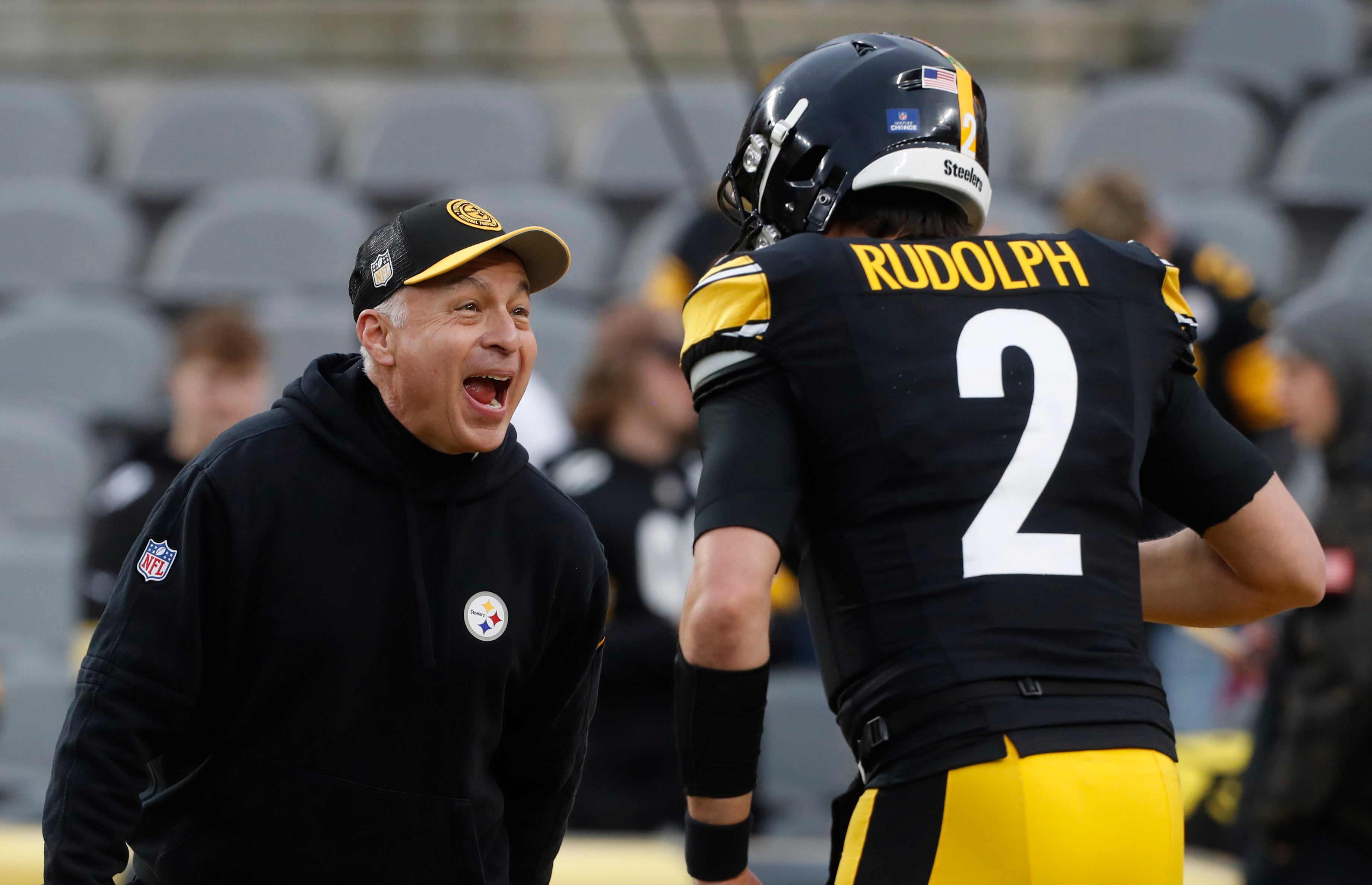 Dec 23, 2023; Pittsburgh, Pennsylvania, USA; Pittsburgh Steelers quarterbacks coach Mike Sullivan (left) reacts to quarterback Mason Rudolph (2) before the game against the Cincinnati Bengals at Acrisure Stadium. Mandatory Credit: Charles LeClaire-USA TODAY Sports  