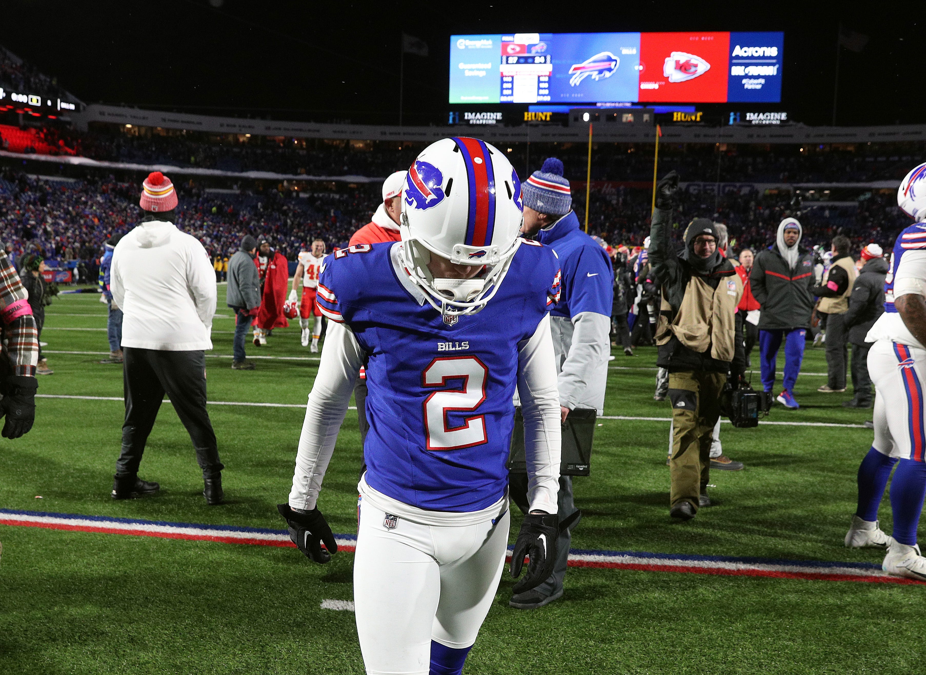 Buffalo Bills place kicker Tyler Bass walks off the field after missing what would have been a game tying field goal in a 27-24 loss to the Chiefs in the divisional round.