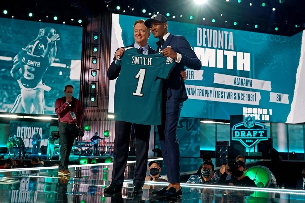 DeVonta Smith (Alabama) with NFL commissioner Roger Goodell after being selected by Philadelphia Eagles as the number ten overall pick in the first round of the 2021 NFL Draft at First Energy Stadium.