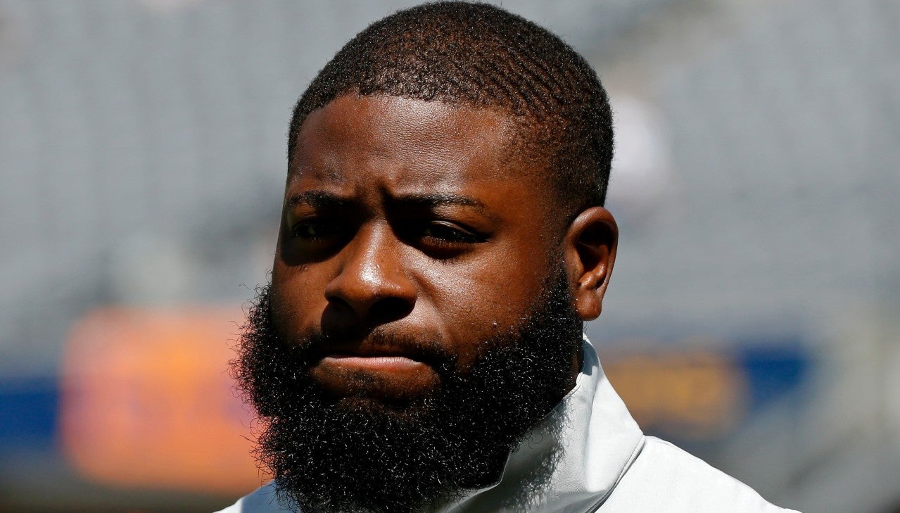 Aug 14, 2021; Chicago, Illinois, USA; Miami Dolphins defensive backs coach Gerald Alexander walks on the field before the game against the Chicago Bears at Soldier Field. Mandatory Credit: Jon Durr-USA TODAY Sports  