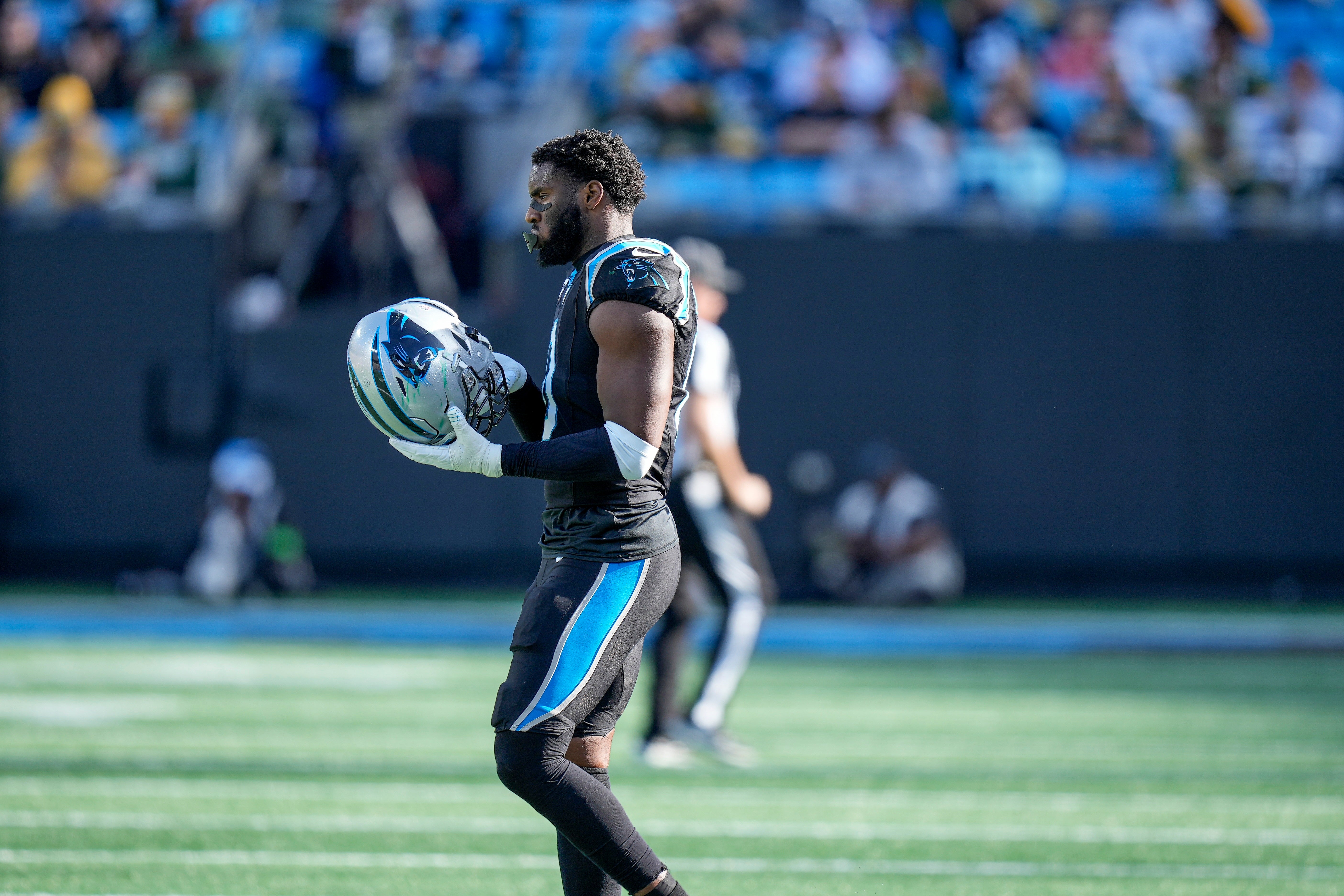 Dec 24, 2023; Charlotte, North Carolina, USA; Carolina Panthers linebacker Brian Burns (0) takes the field after a time out during the second quarter against the Green Bay Packers at Bank of America Stadium. Mandatory Credit: Jim Dedmon-USA TODAY Sports