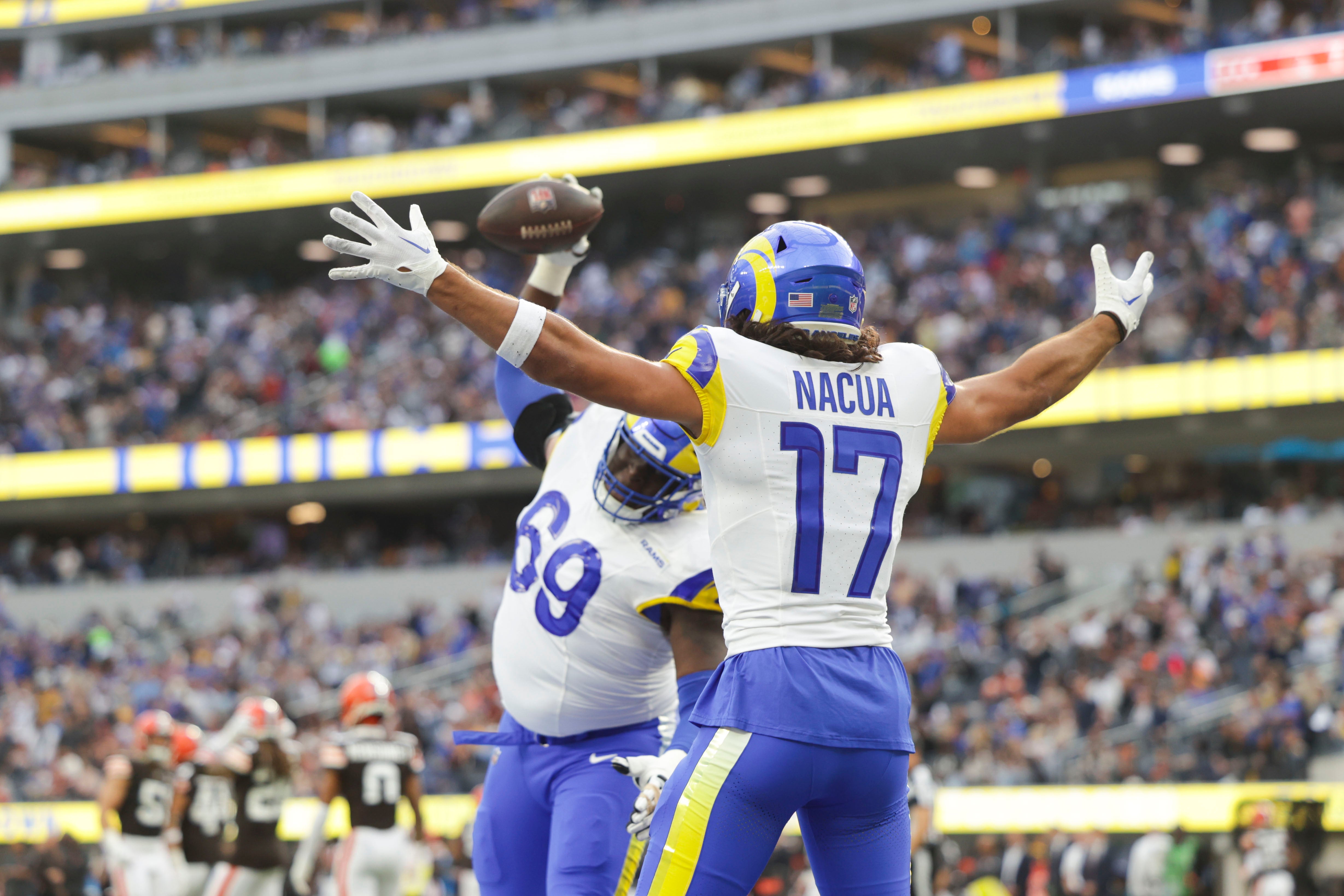 Dec 3, 2023; Inglewood, California, USA; Los Angeles Rams offensive linesmen Kevin Dotson (69) celebrates with Los Angeles Rams wide receiver Puka Nacua (17) after scoring a touchdown in the first half in a game against the Cleveland Browns at SoFi Stadium. Mandatory Credit: Yannick Peterhans-USA TODAY Sports