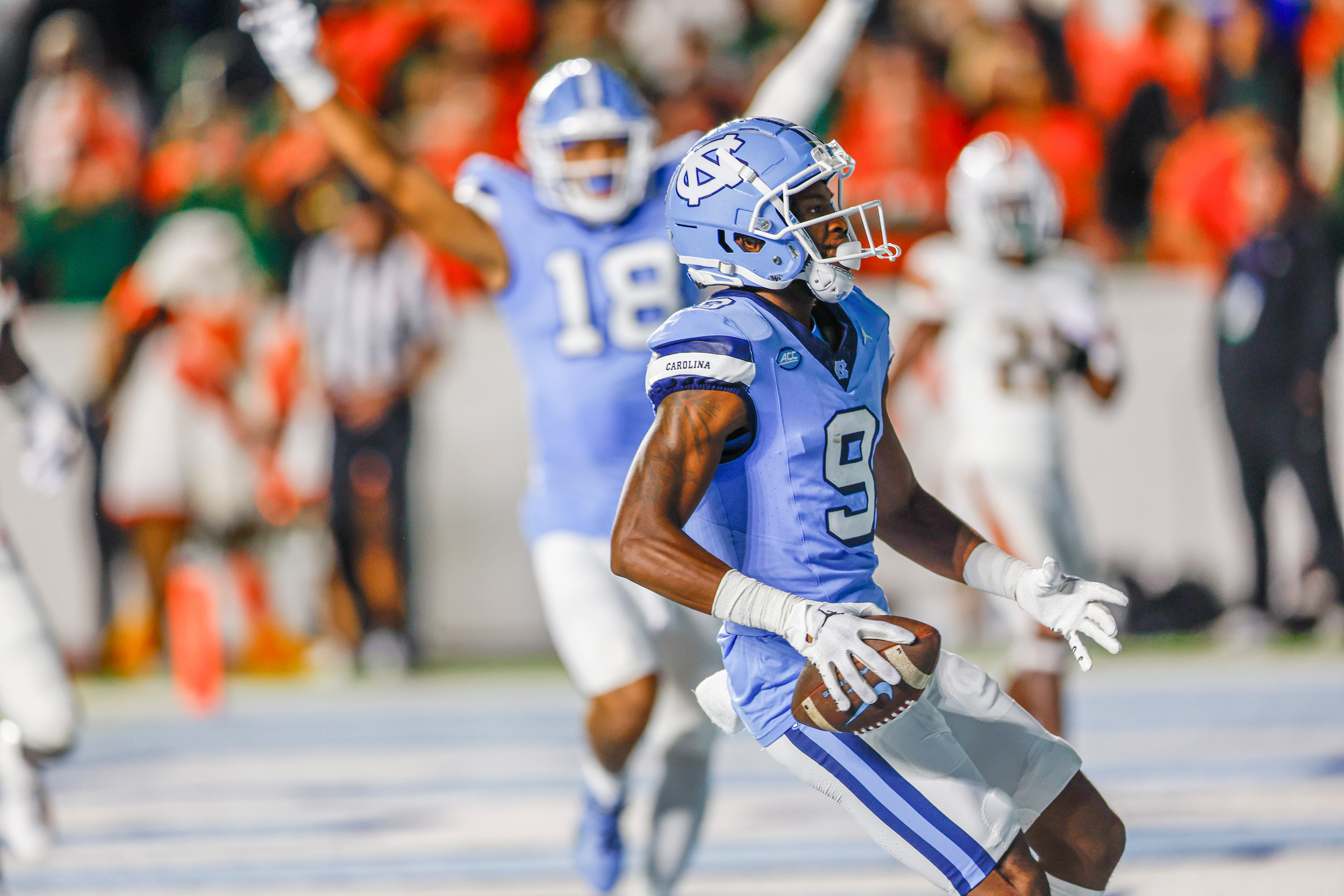 Oct 14, 2023; Chapel Hill, North Carolina, USA; North Carolina Tar Heels wide receiver Devontez Walker (9) scores a touchdown against the Miami Hurricanes in the first half at Kenan Memorial Stadium. Mandatory Credit: Nell Redmond-USA TODAY Sports